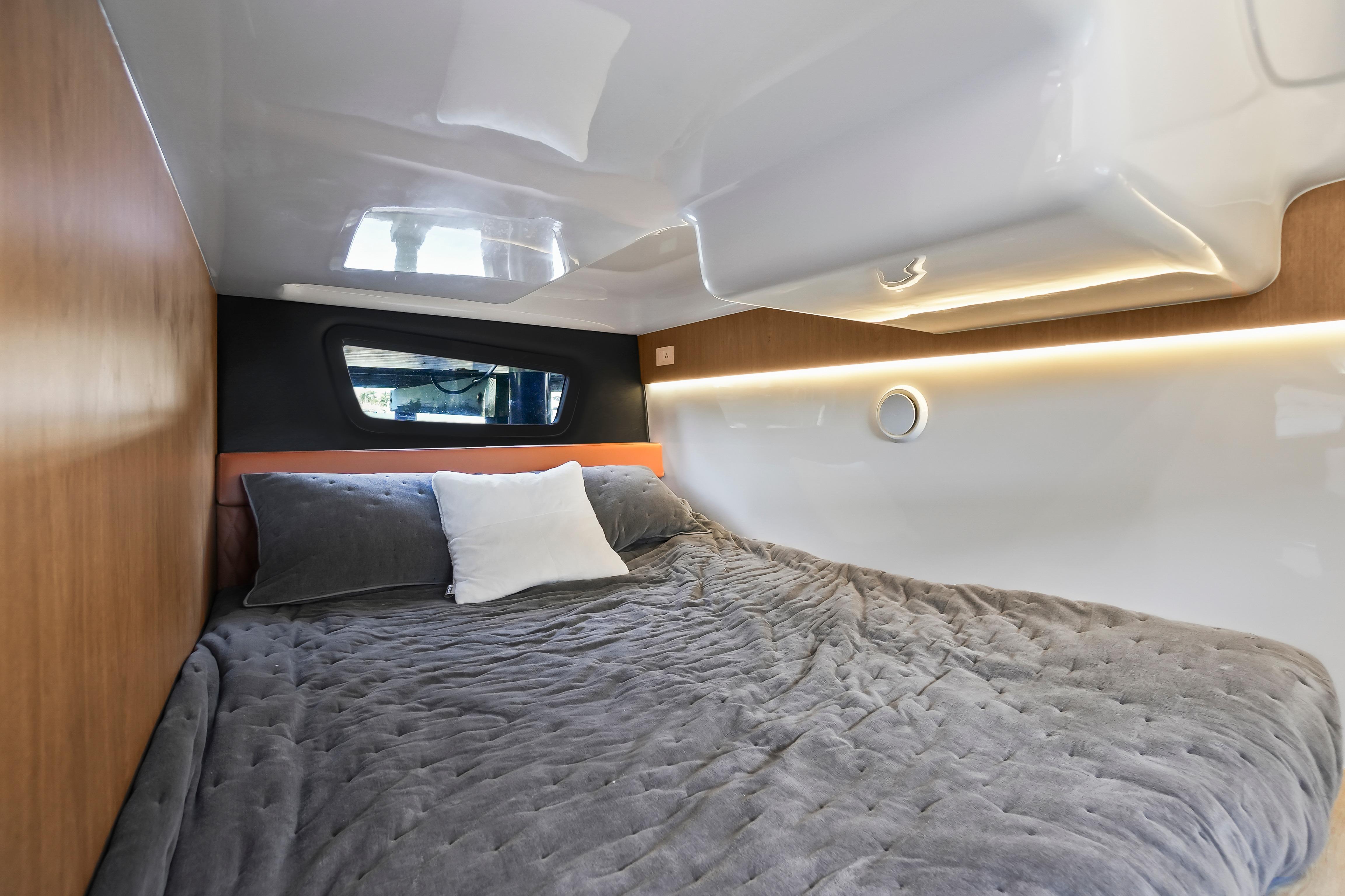 Cozy interior of 2026 Hanover 355 with plush bedding and modern design.