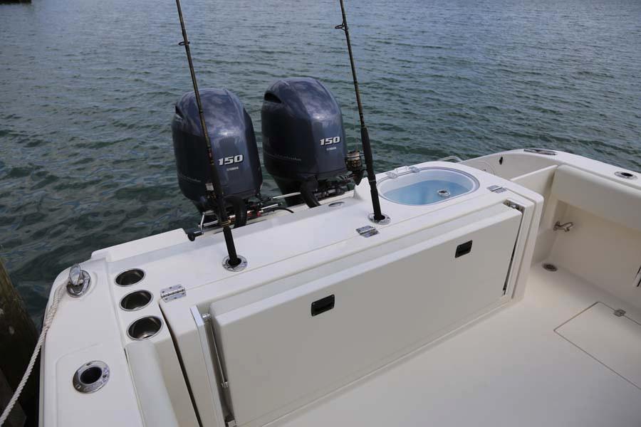 Manufacturer Provided Image: 2022 Cobia 262 Center Console boat with twin 150 HP engines on the water.