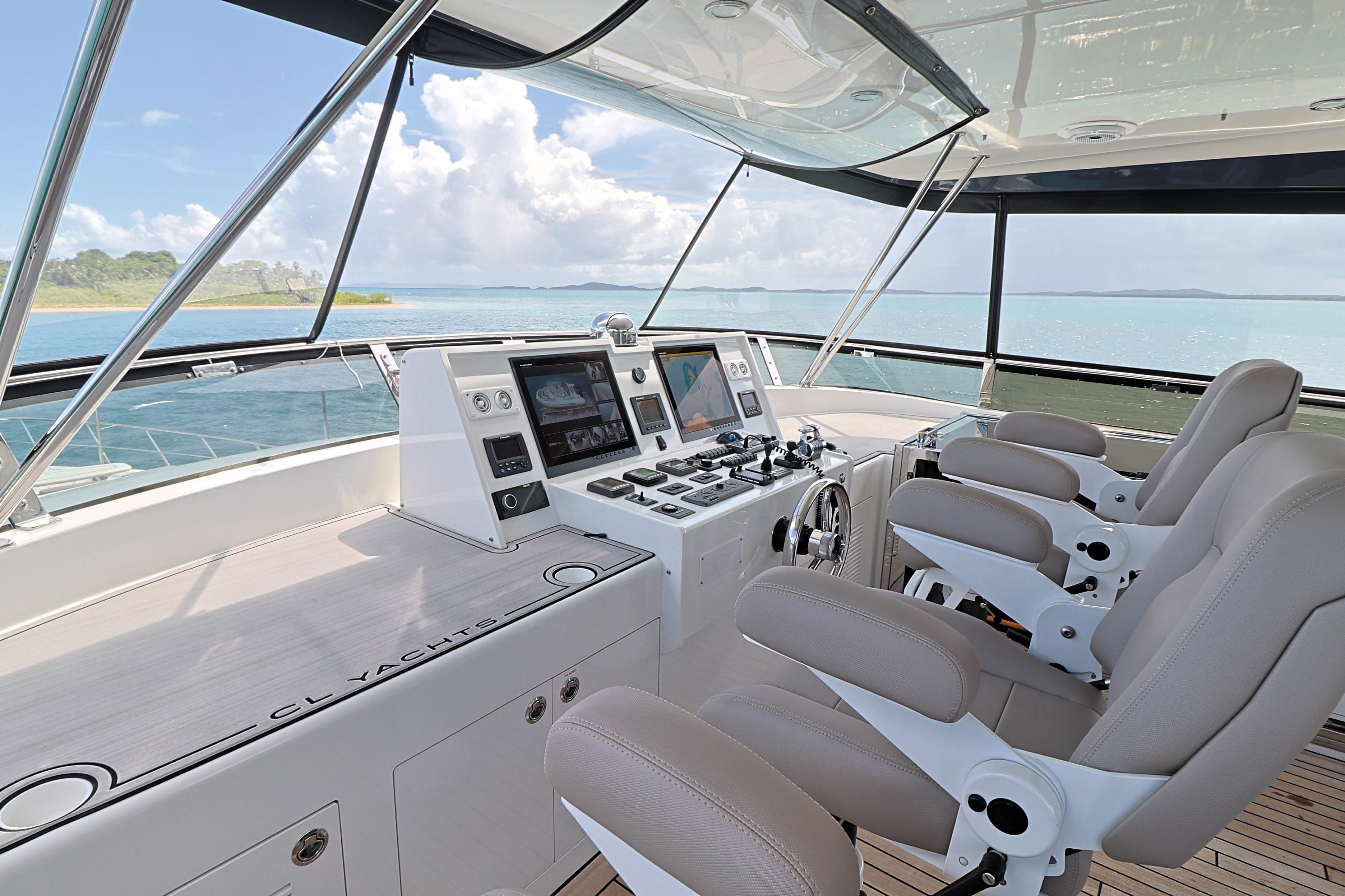 2013 Cheoy Lee Bravo yacht helm with modern controls and ocean view.