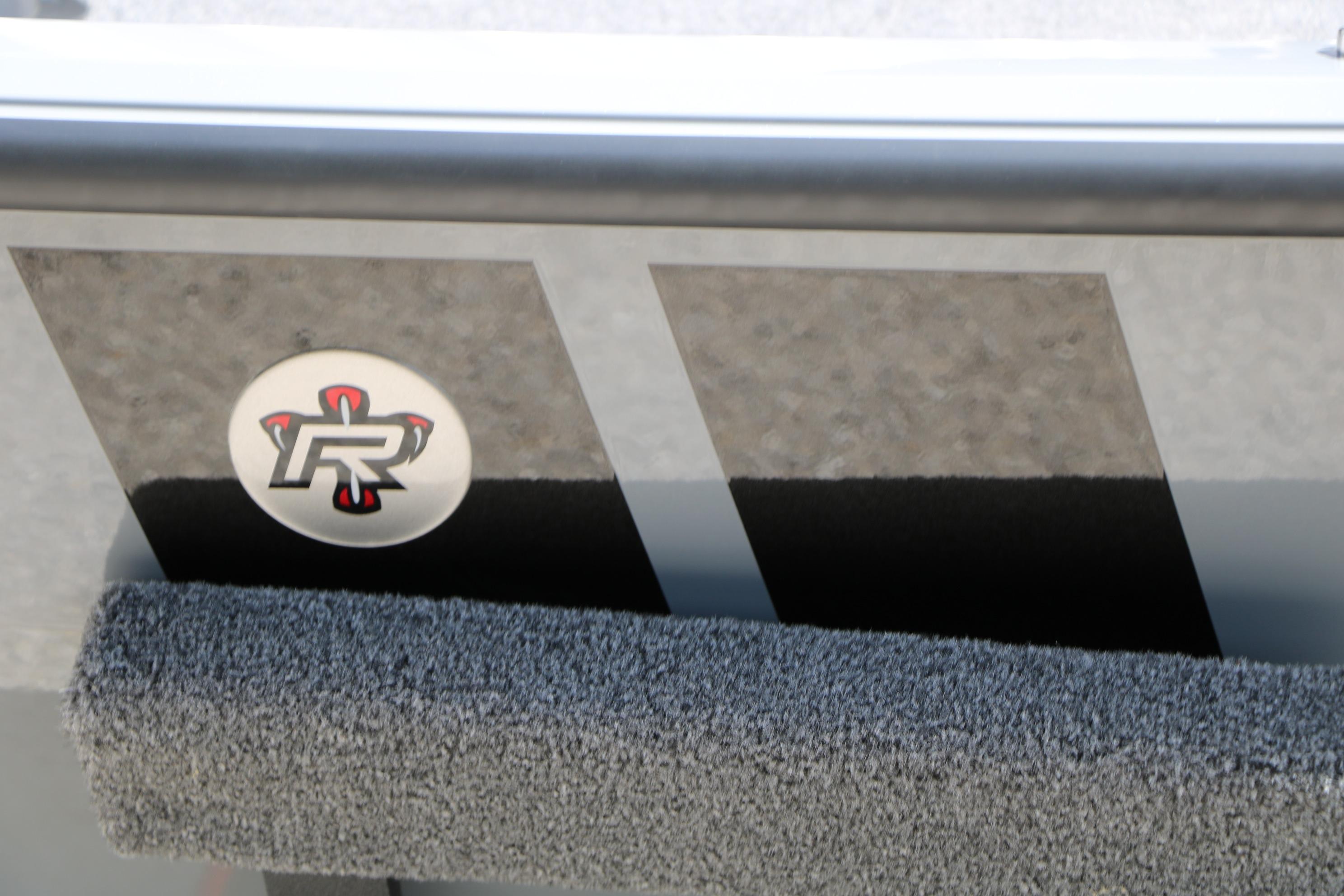 2026 Vexus AVX1980 boat detail with logo and textured surface.