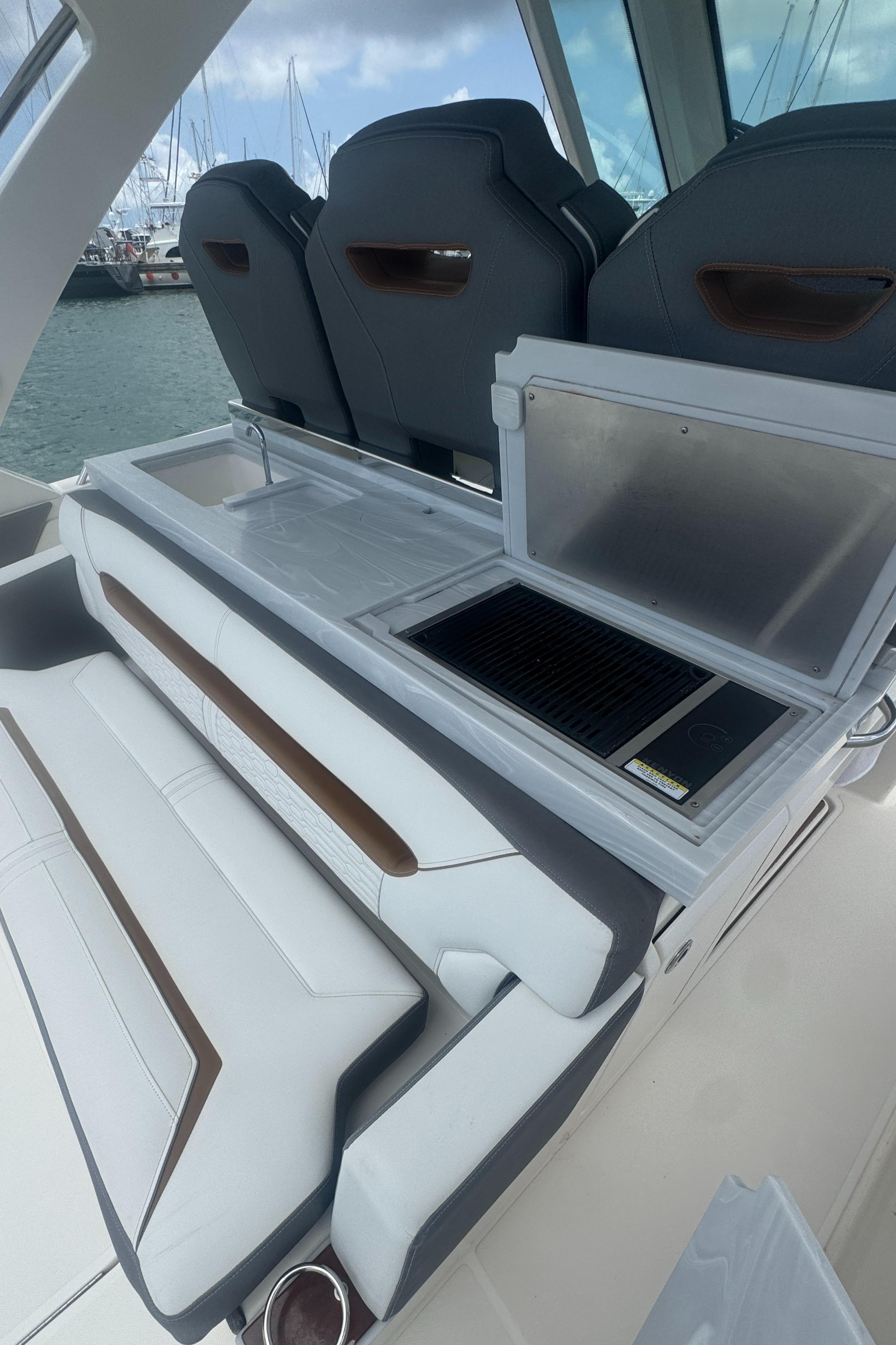 2020 Tiara Sport 34 LS boat interior with seating and grill station.