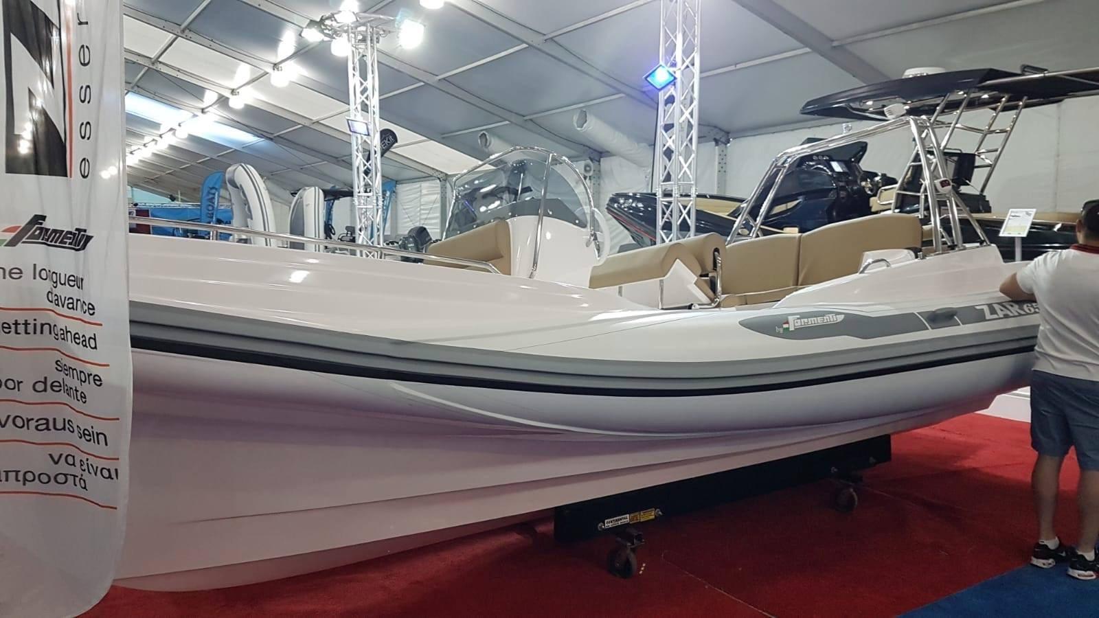 2023 Zar Formenti Zar 65 boat displayed at an indoor boat show.