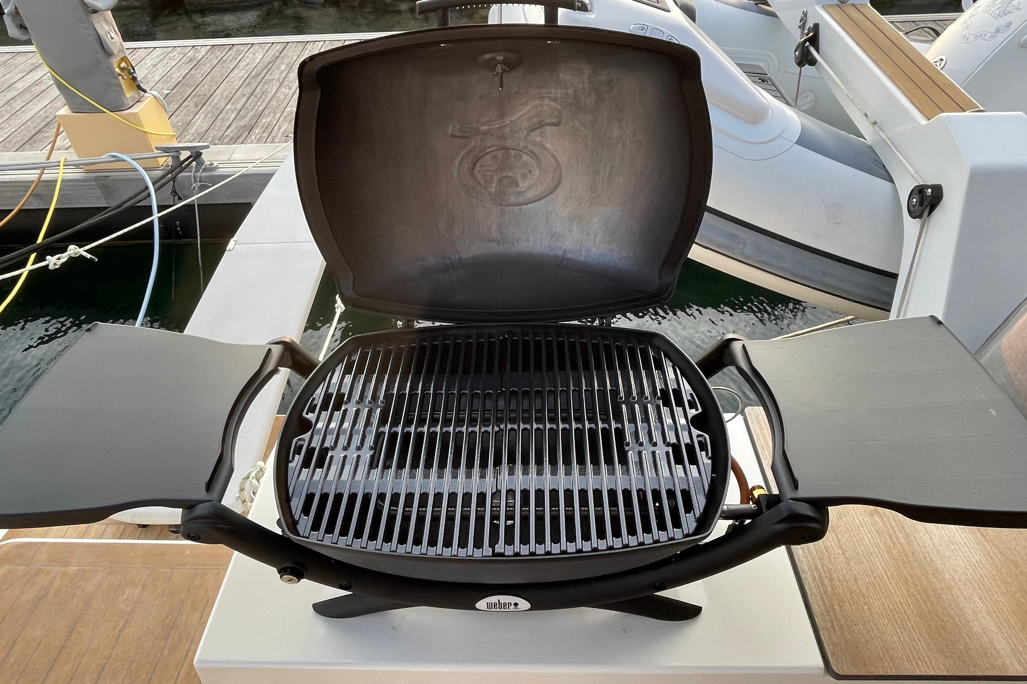 Open grill on a 2020 Fountaine Pajot Saona 47 catamaran, docked at a marina.