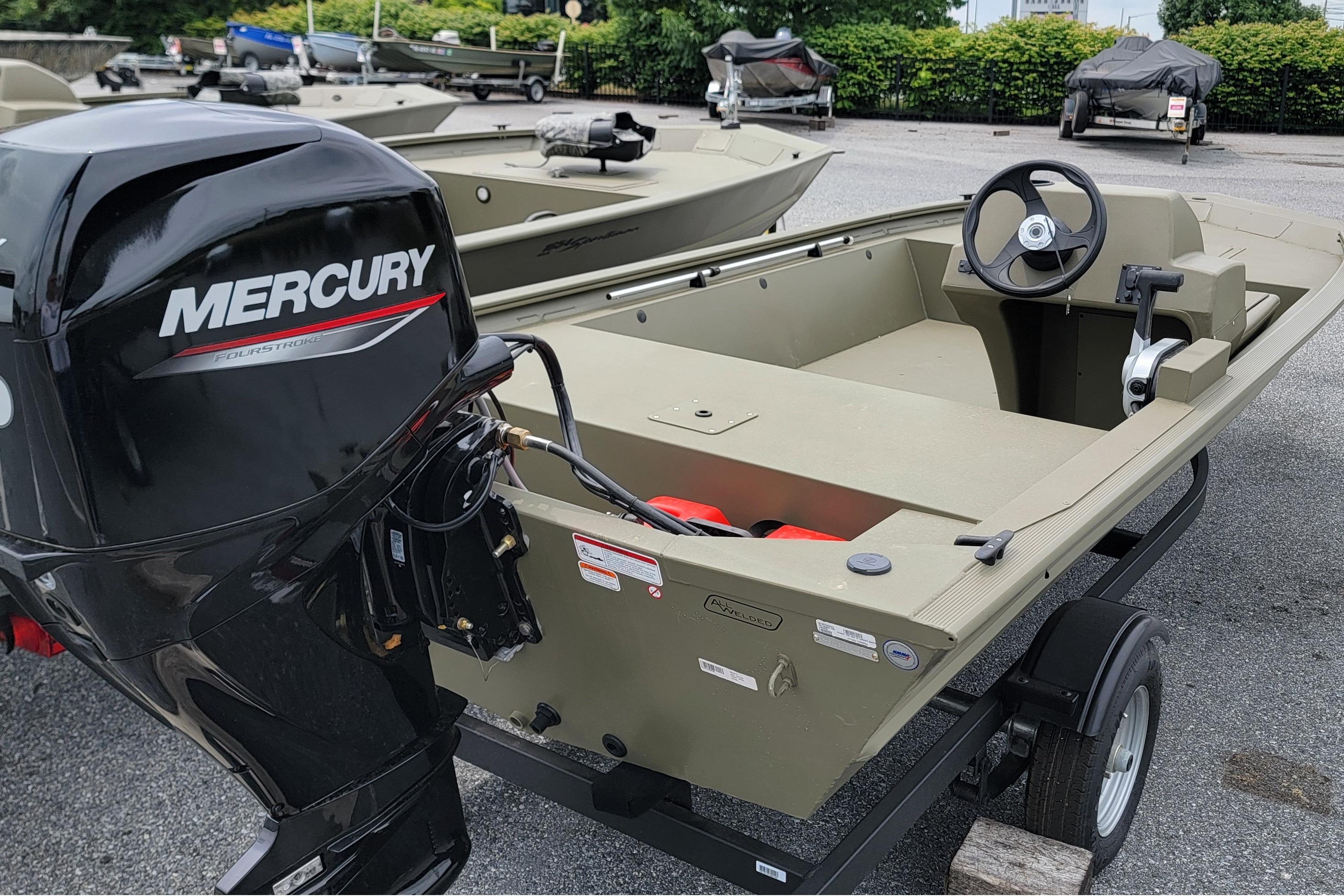 2026 Tracker Grizzly 1648 SC boat with Mercury outboard motor on trailer.