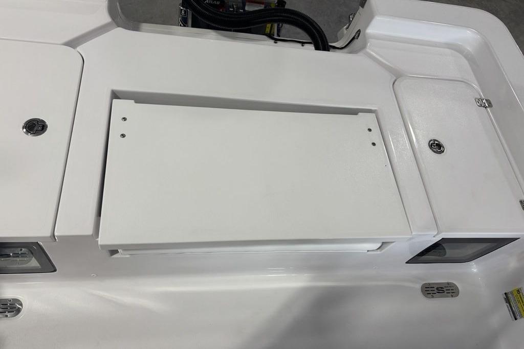 2026 Sportsman Masters 247 Bay Boat deck with storage compartments and clean design.