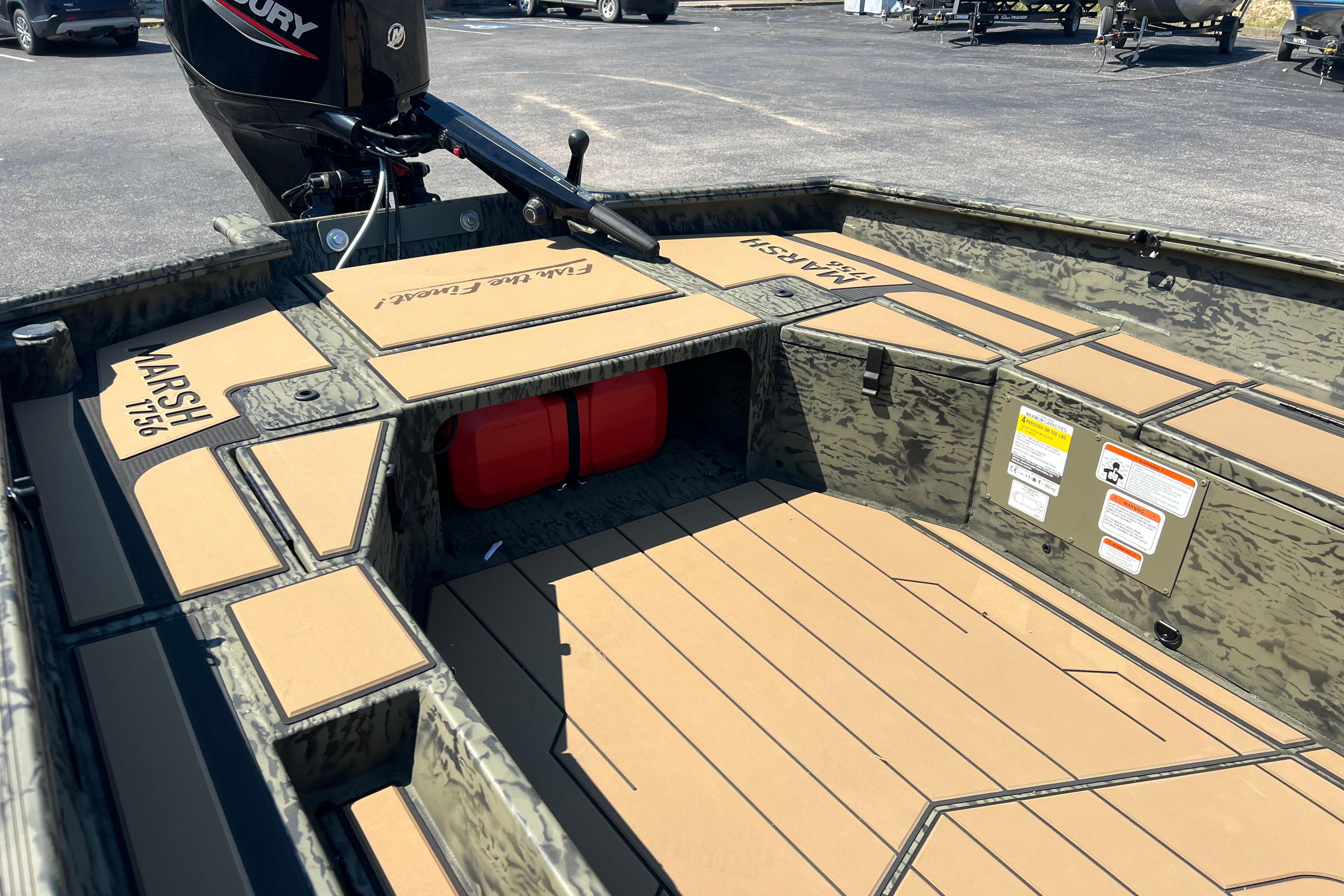 2026 Tracker Grizzly 1756 T Marsh boat interior with camo design and Mercury engine.