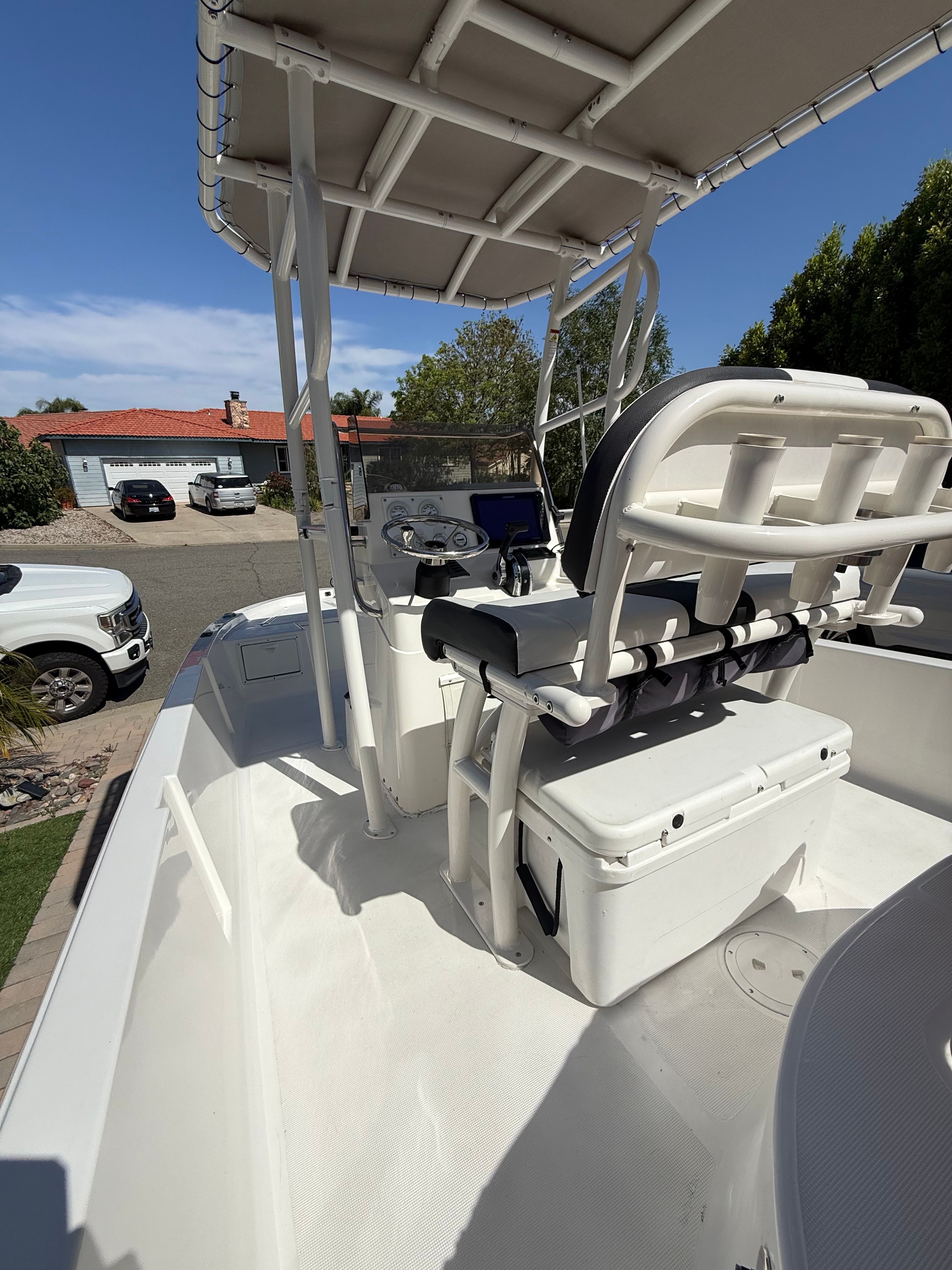 1998 Robalo 2100 Bay Hunter boat with T-top and seating.