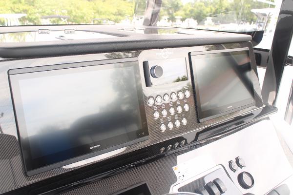 2024 Fountain 34 SC dashboard with dual screens and control panel.