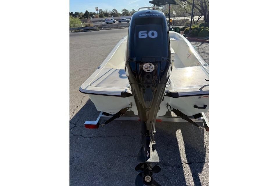 2026 Mako Pro Skiff 15 CC with Mercury 60 outboard motor on trailer.