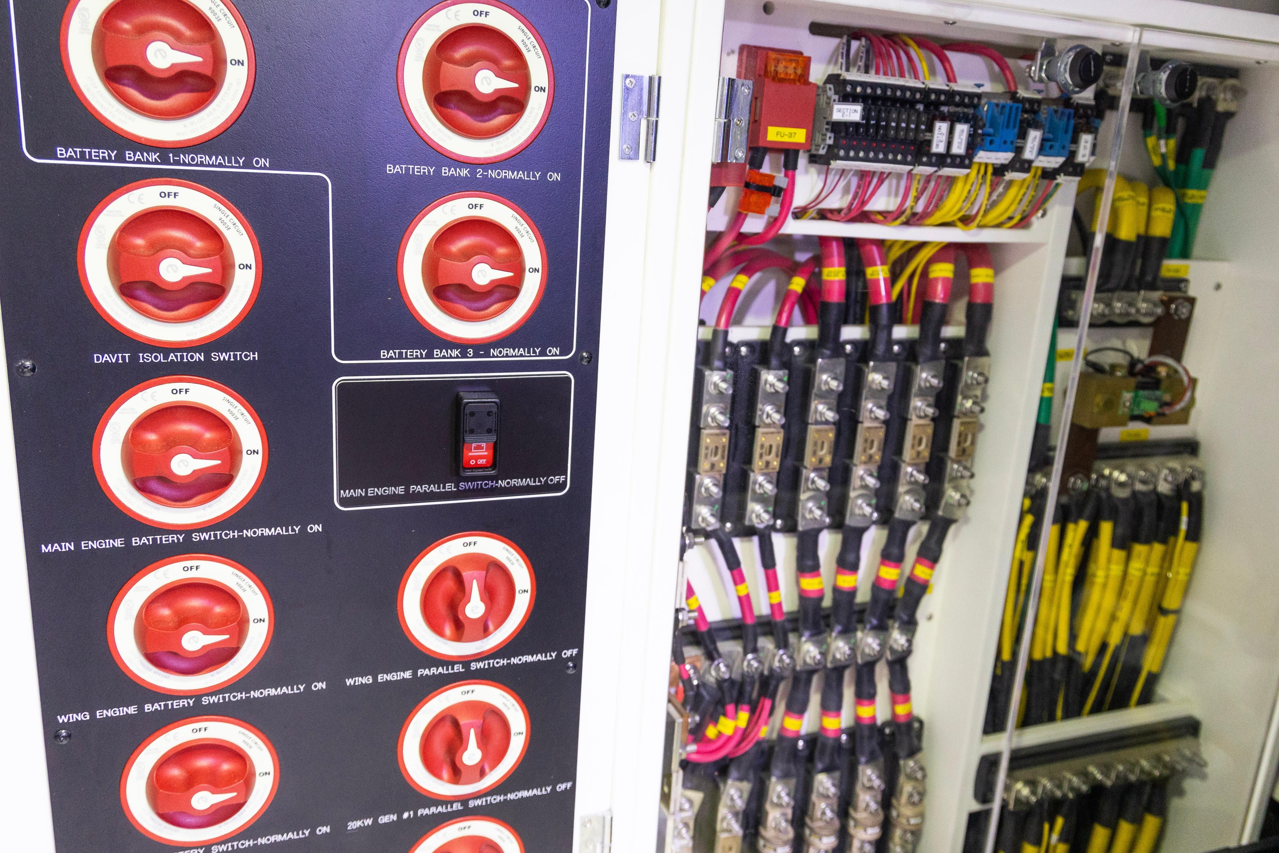 Electrical panel with switches and wiring in a 2018 Nordhavn 76 yacht.
