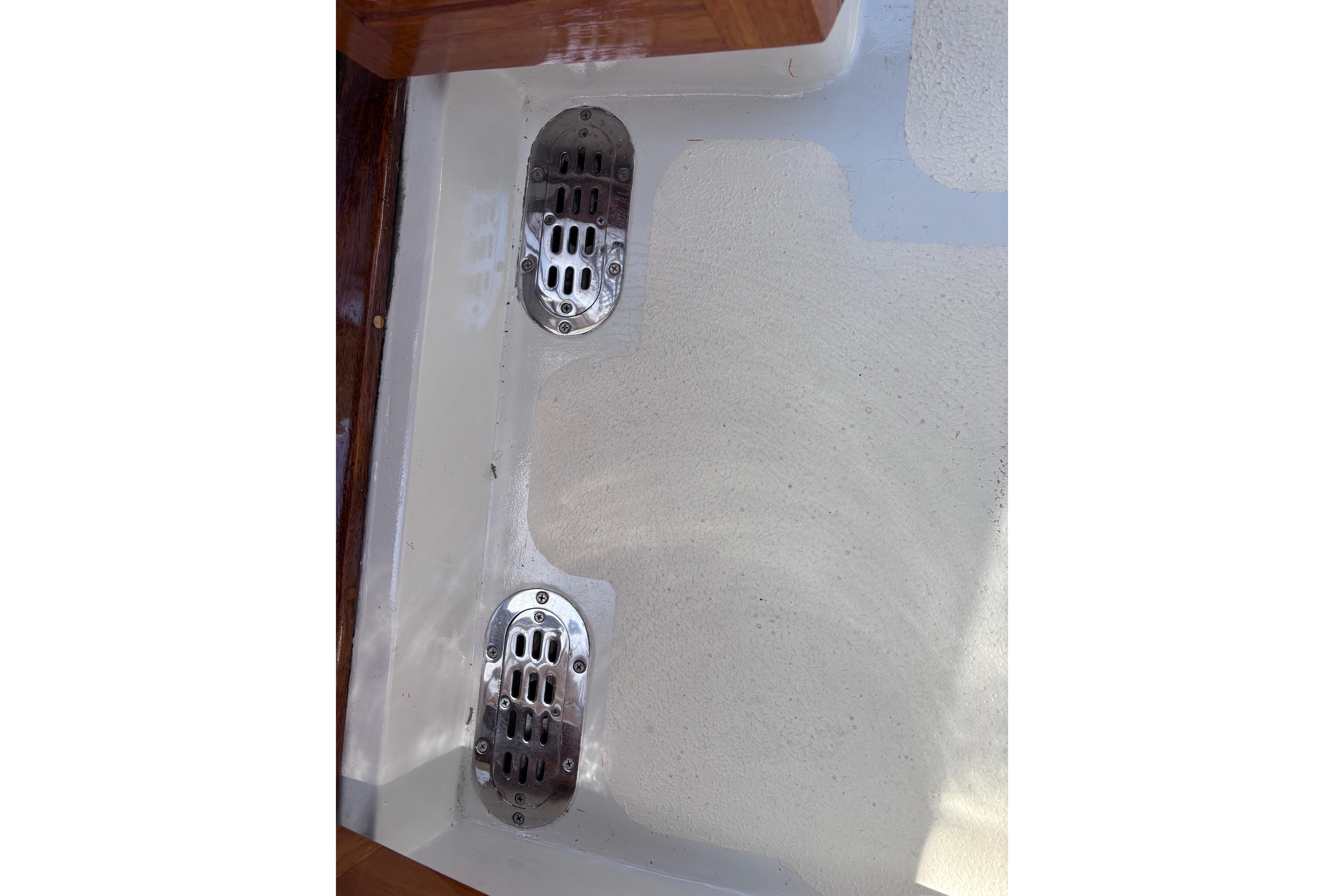 Stainless steel drains on a 1978 Swift 33 boat deck.