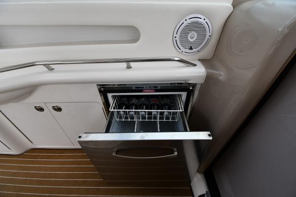 Open drawer with wine bottles on a 2003 Sea Ray 460 Sundancer yacht.