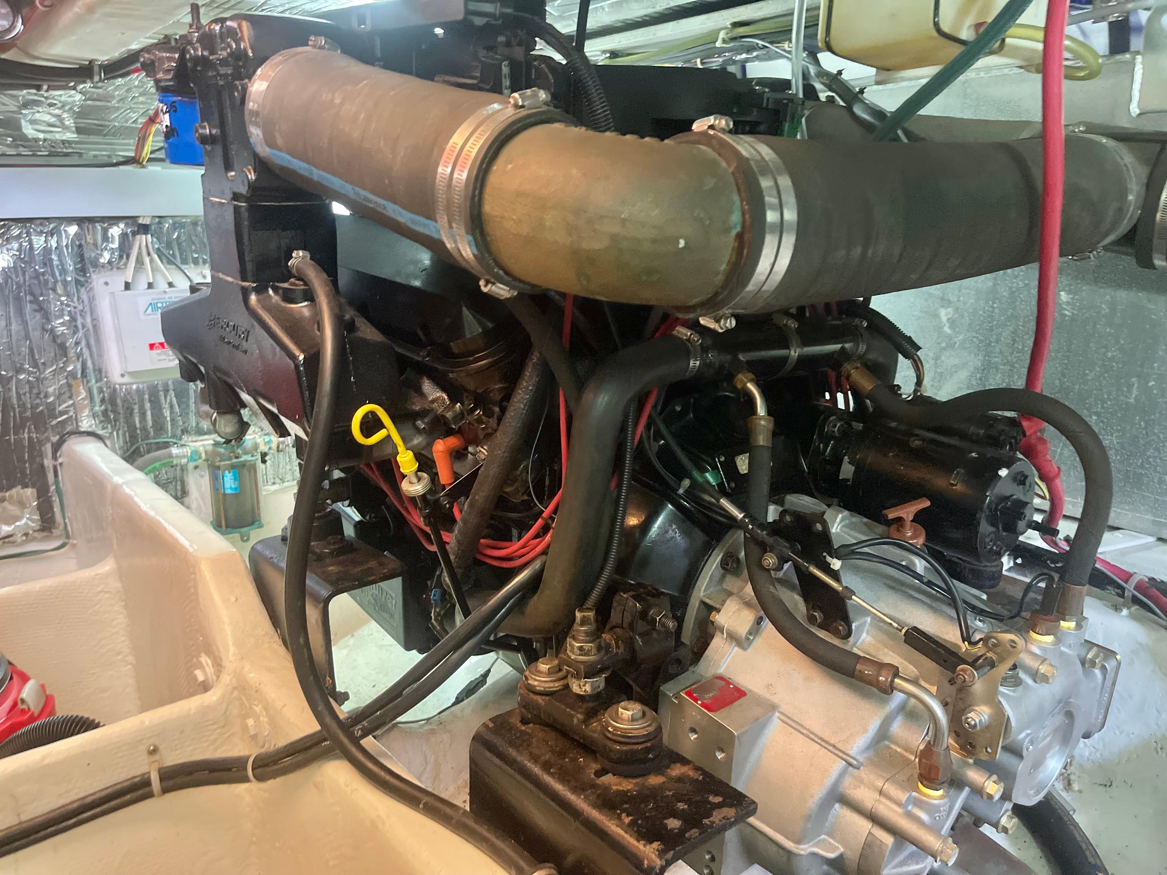 Engine compartment of a 1998 Maxum 4100 SCA boat, showcasing mechanical components and wiring.