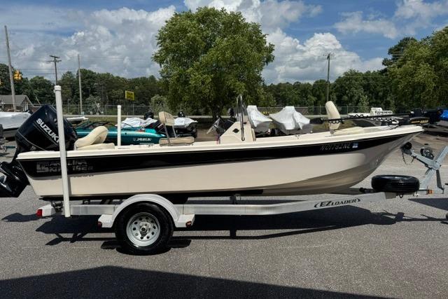 2023 Carolina Skiff 192 JLS boat on trailer, parked outdoors under a cloudy sky.