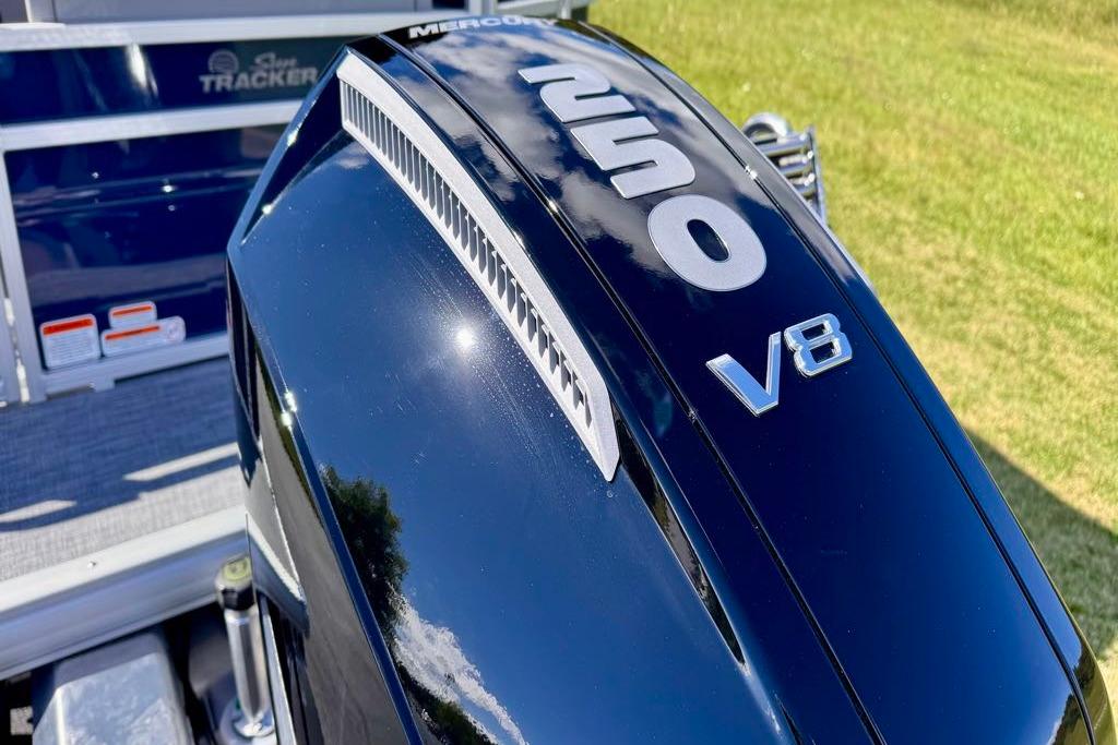 2026 Sun Tracker Sportfish 24 XP3 with powerful V8 engine, close-up view.