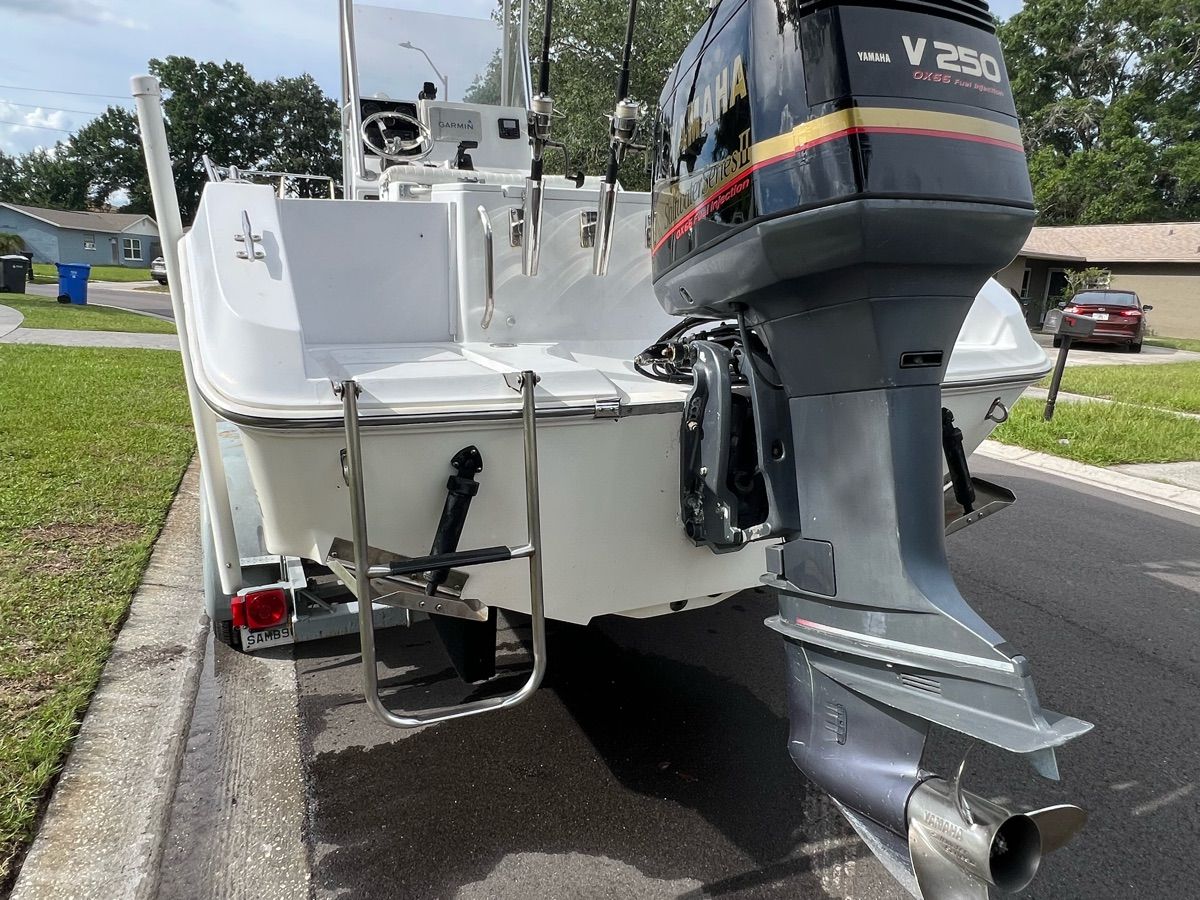 A 1994 Sea Ray Laguna with a Yamaha V250 outboard motor, parked on a street.