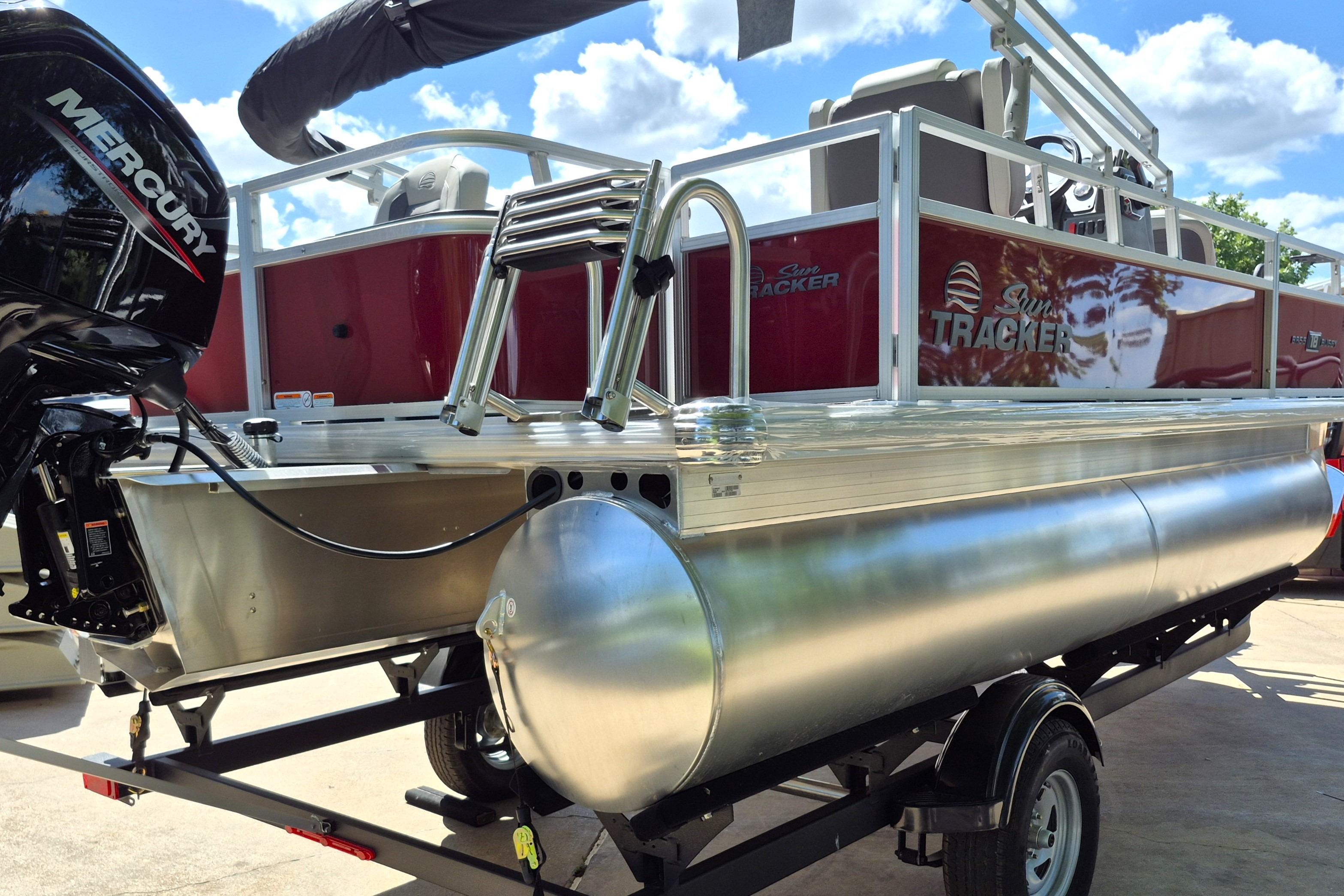 2026 Sun Tracker Bass Buggy 18 DLX pontoon boat with Mercury engine on trailer.