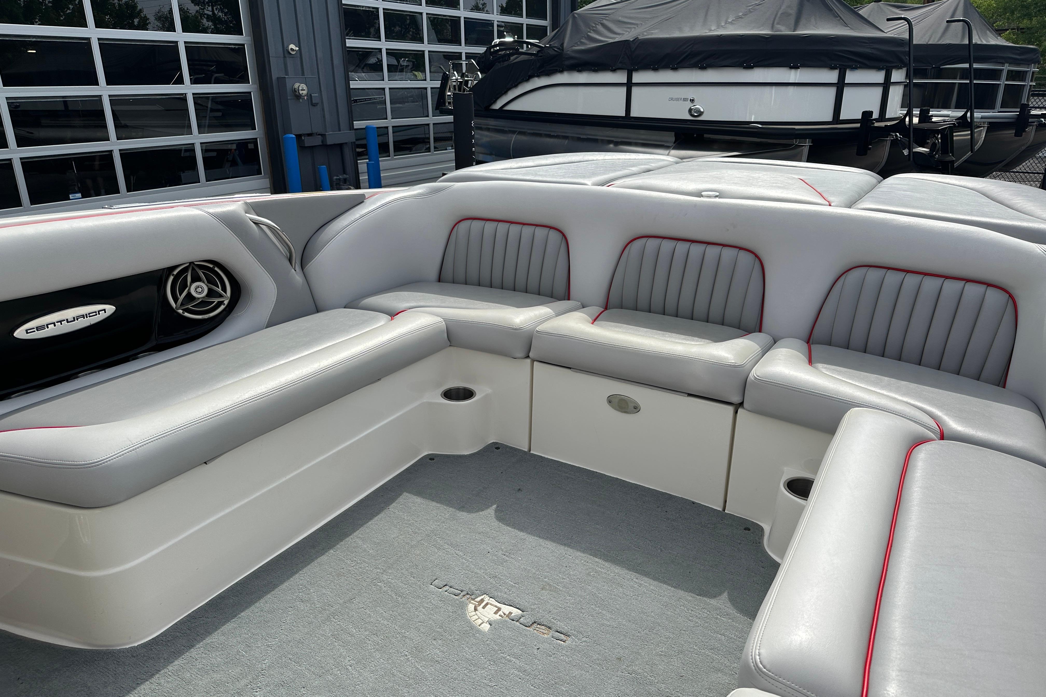 2008 Centurion Enzo SV240 boat interior with gray seating and red accents.