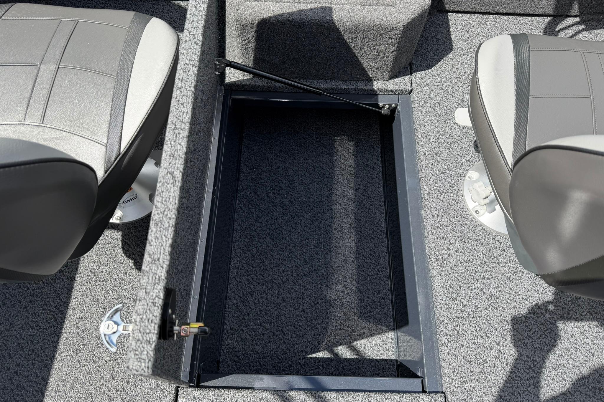 2027 Lund 1875 Crossover XS boat interior with open storage compartment and two seats.