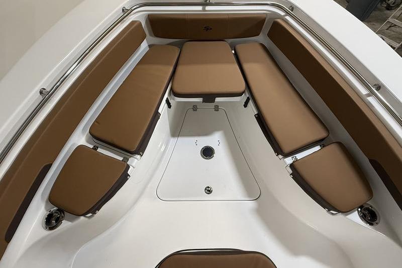 2026 Sea Pro 242 Center Console boat interior with brown cushioned seating.