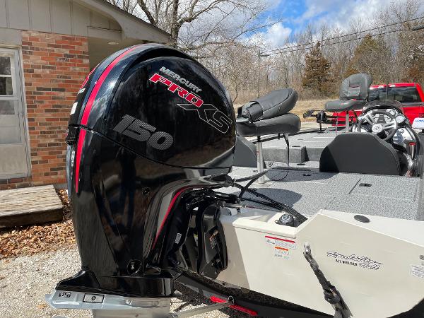 2021 Tracker Pro 195 XTE boat with Mercury Pro XS 150 engine, parked outdoors.