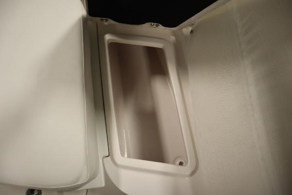 2025 Sea Fox 228 Commander boat storage compartment, open and empty.
