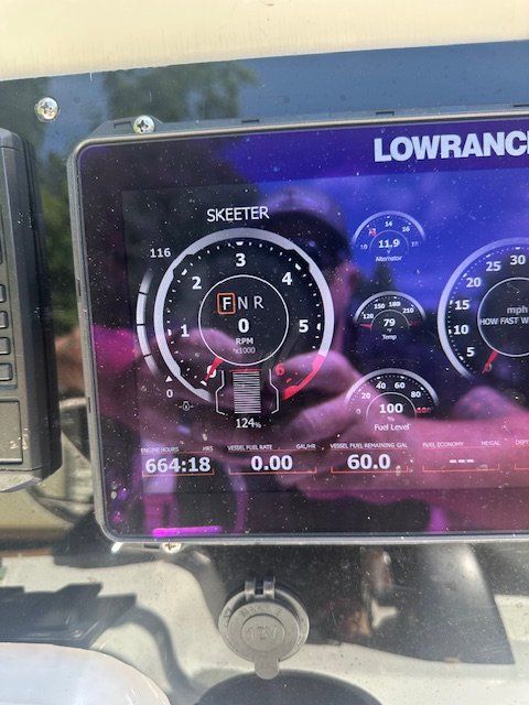 Lowrance display on Skeeter ZX2200 boat, showing tachometer and gauges.