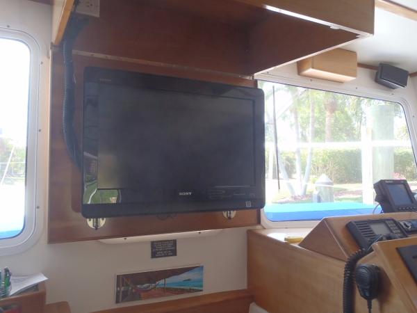 Interior of 2025 Great Harbour N40 boat with mounted TV and navigation equipment.