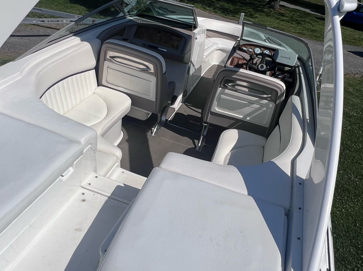 Interior of a 2003 Cobalt 262 boat with white seating.