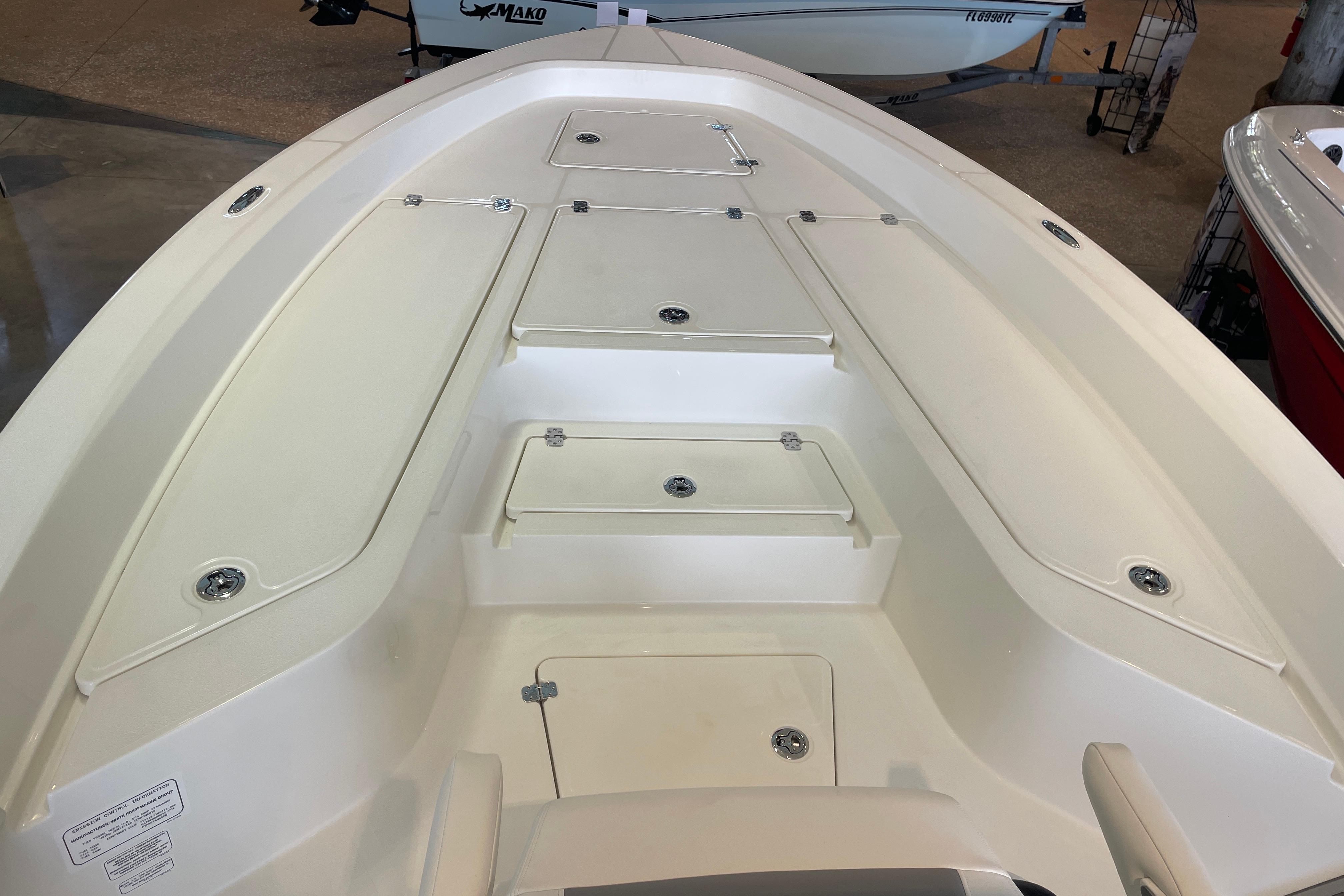 2026 Mako 24 APEX boat interior with storage compartments and sleek design.