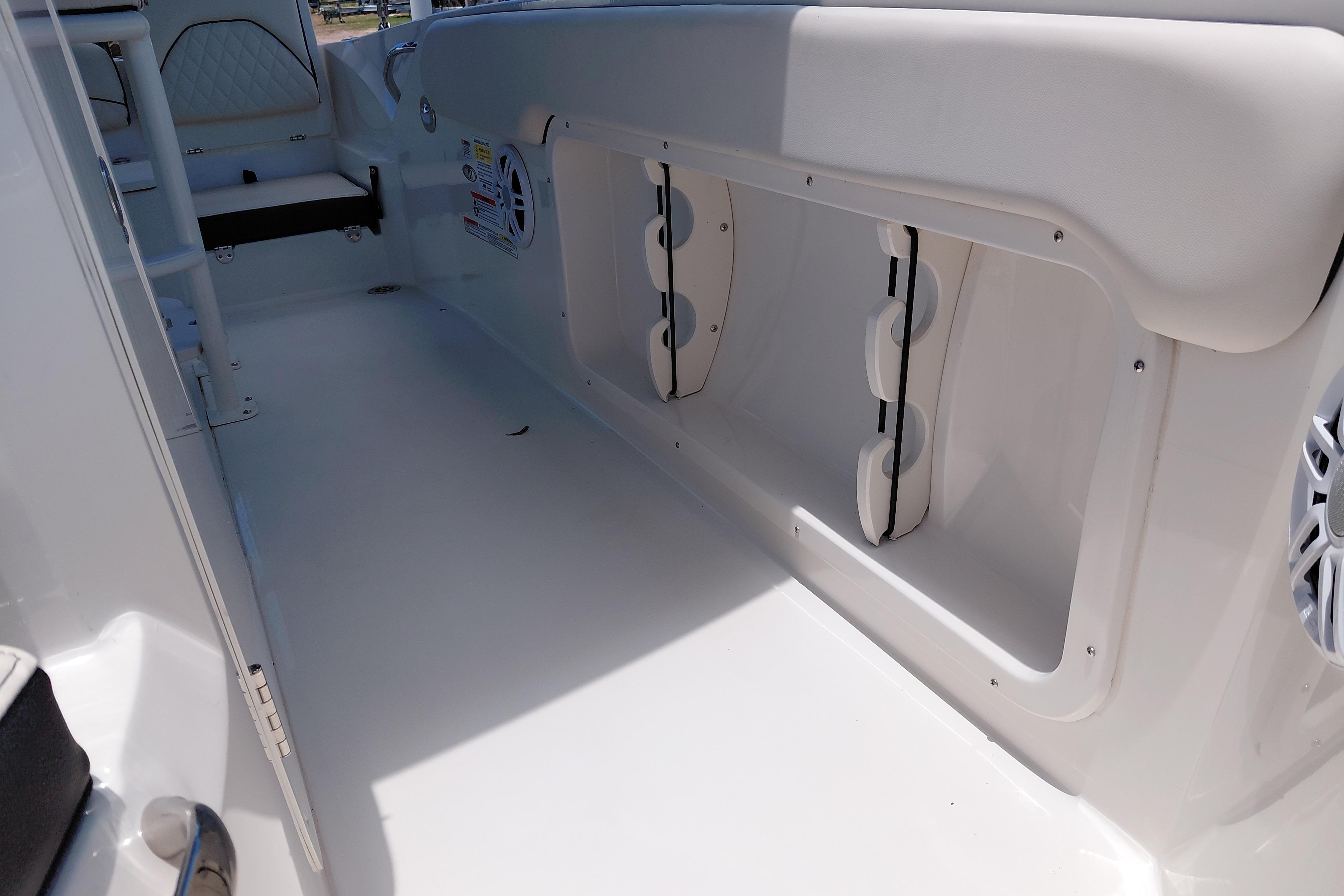 Interior view of 2023 Stingray 206 CC boat, showcasing seating and storage compartments.