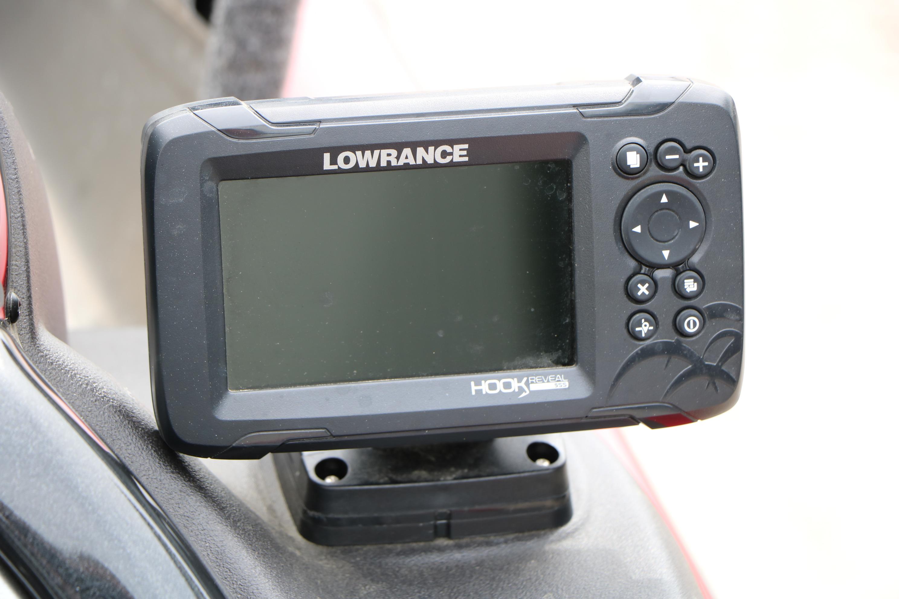 Lowrance Hook Reveal fish finder on 2024 Tracker Pro Team 175 boat dashboard.