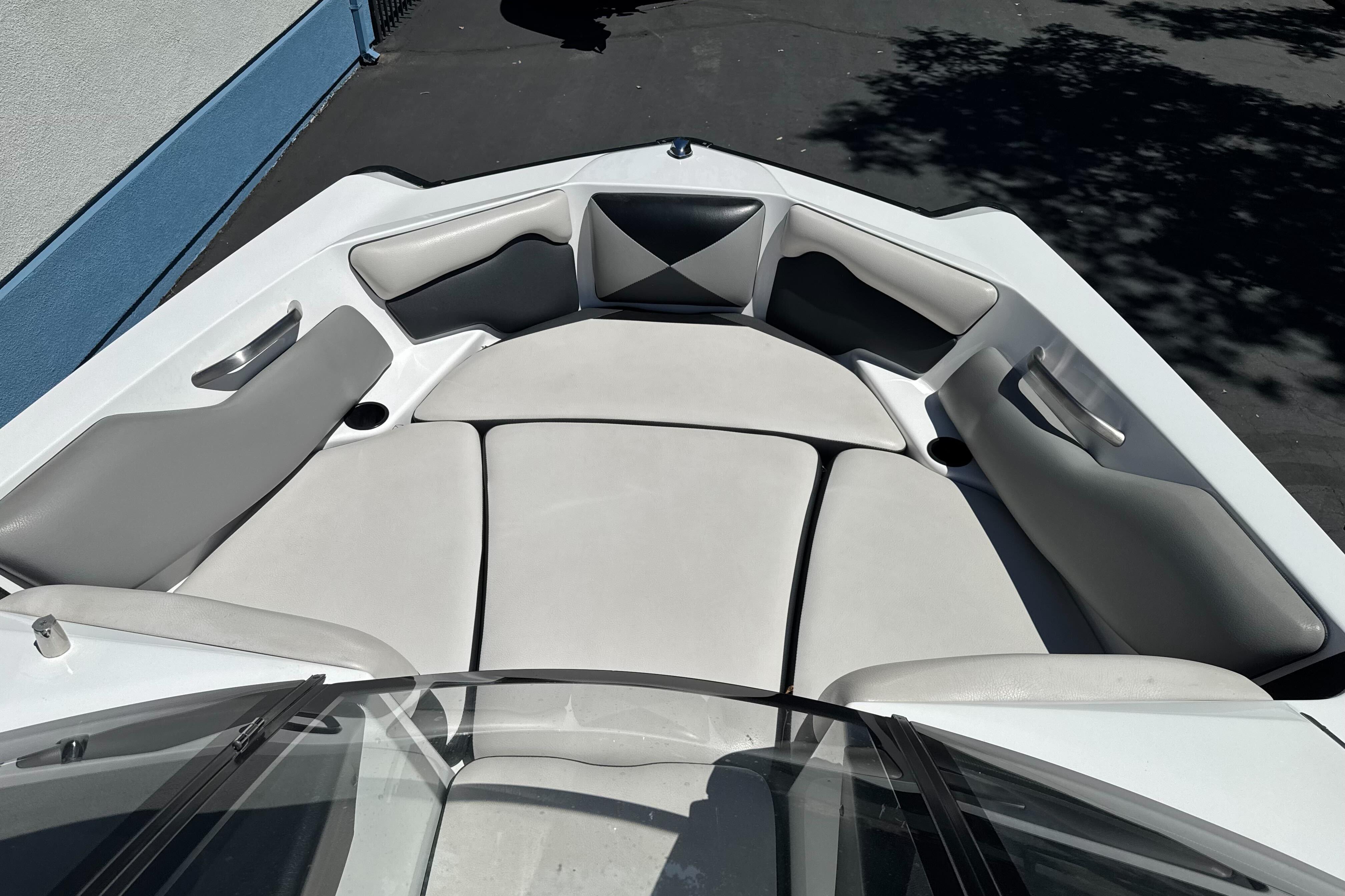 2015 Axis A20 boat interior with gray and white cushioned seating.