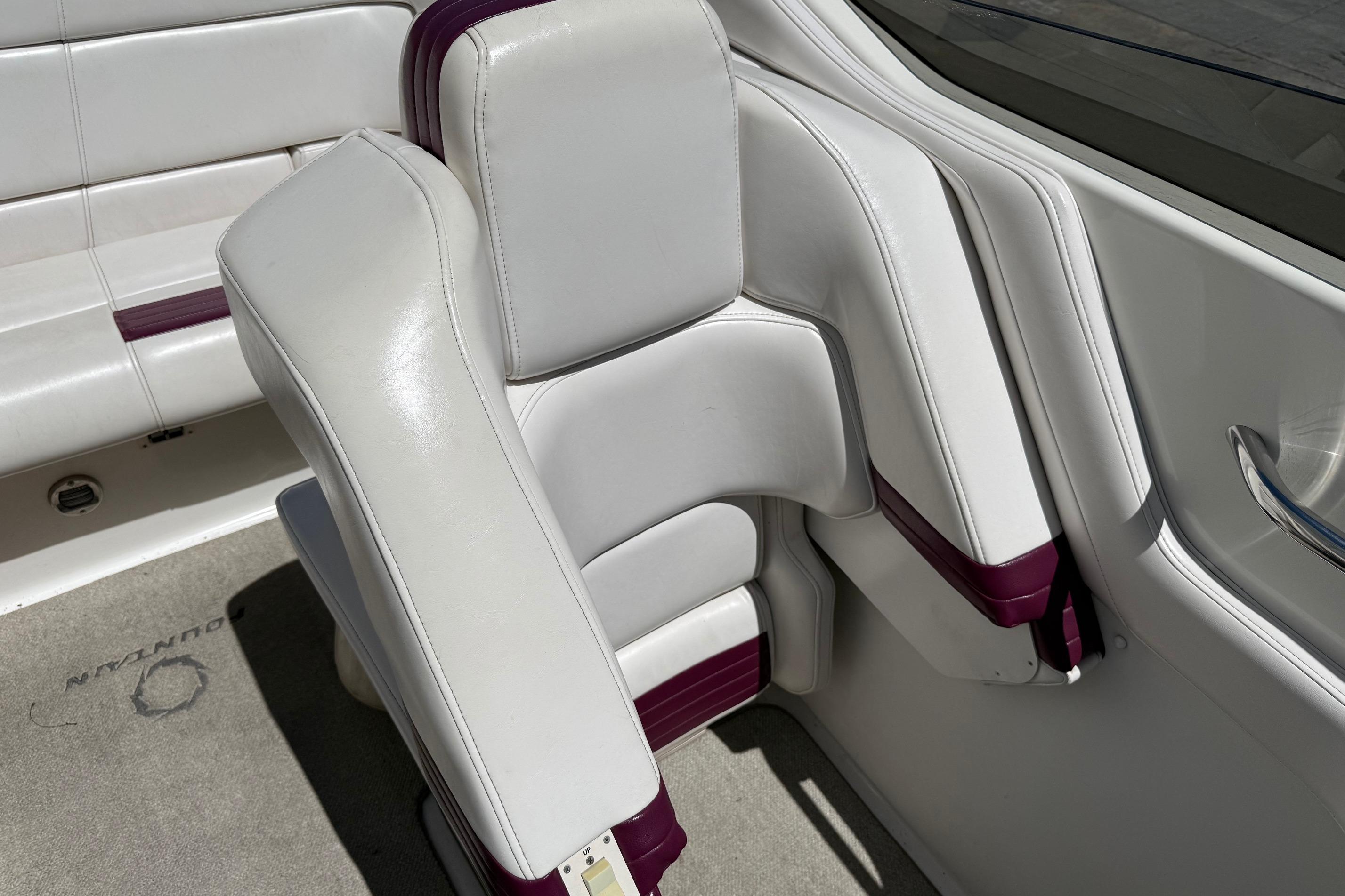 White and maroon seating in a 1998 Fountain 35 Lightning boat interior.