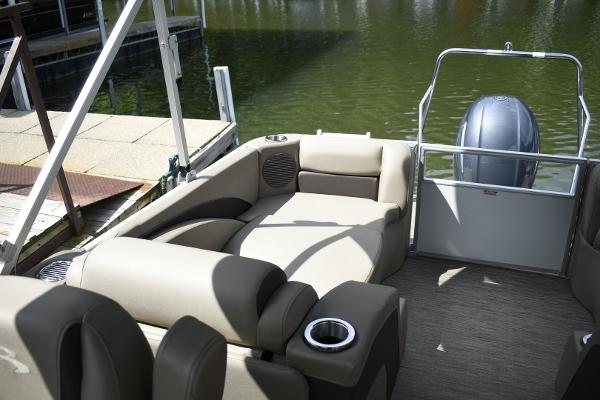2023 Bennington 22 SXCW pontoon boat with comfortable seating and cup holders.