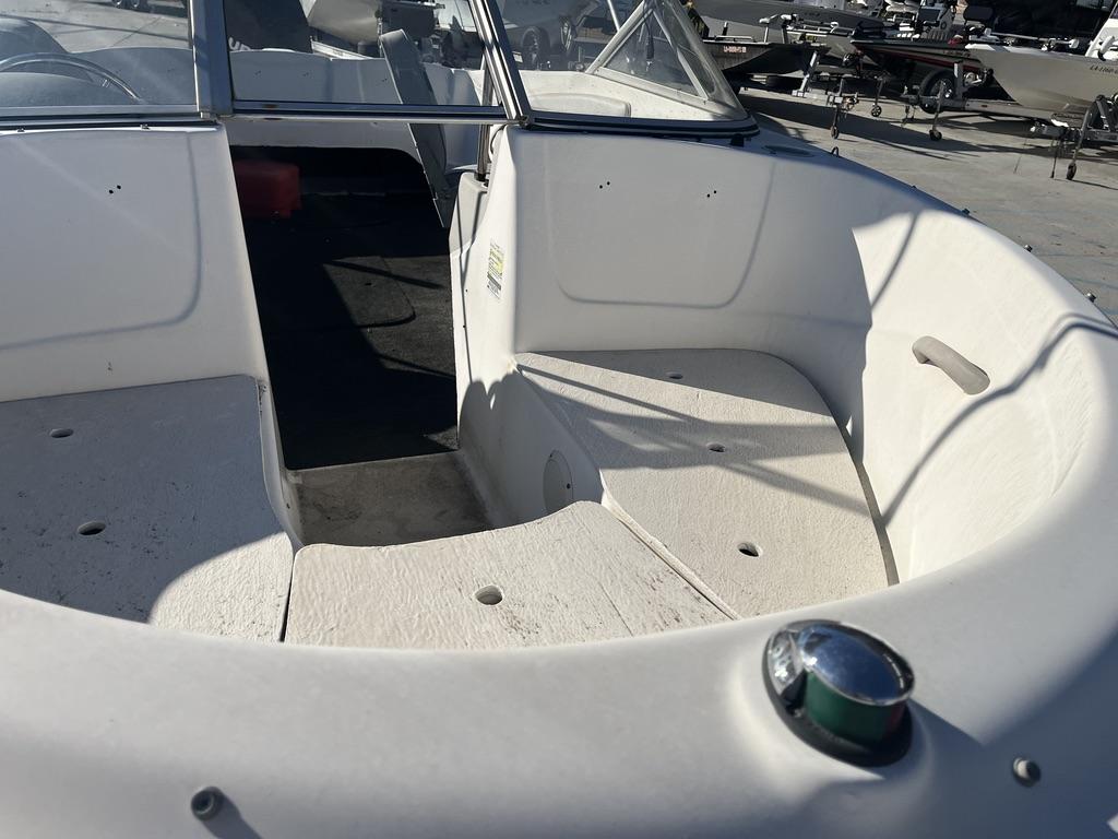 Interior view of a 2004 Bayliner 175 boat, white seating area.