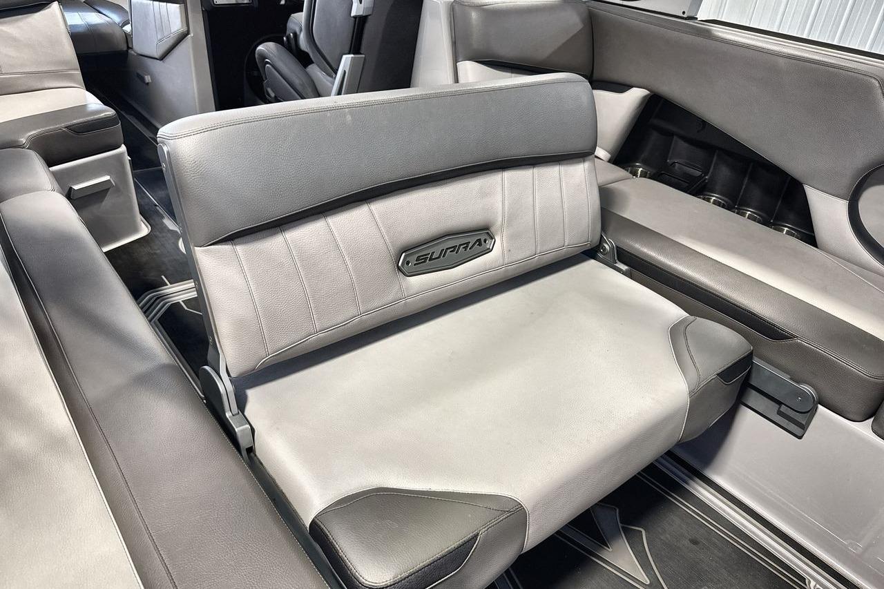 2021 Supra SE 550 interior seating with gray upholstery and branded logo.