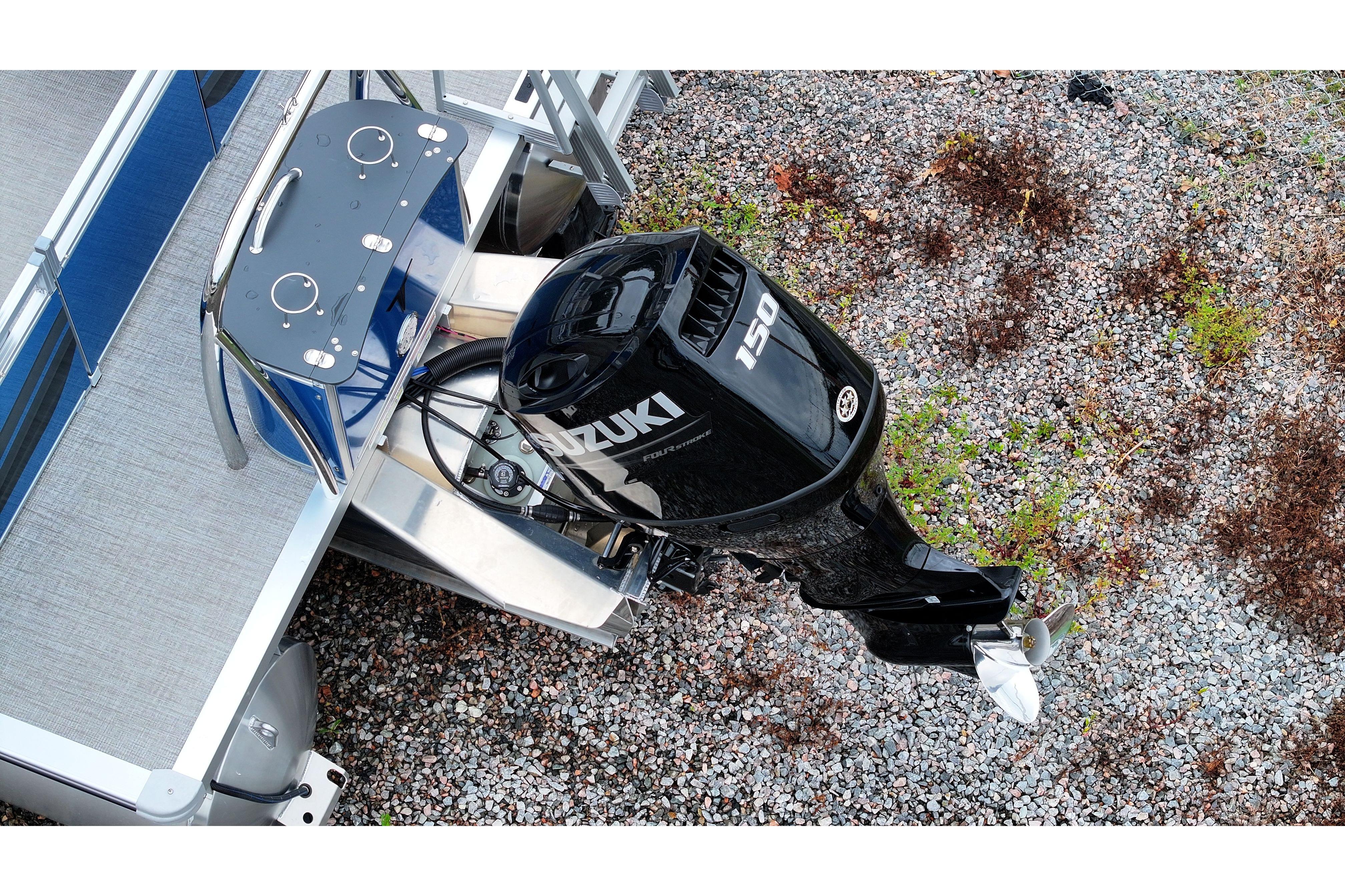 2026 Tahoe Pontoon Sport 85 Quad Lounger with Suzuki 150 outboard motor, aerial view.