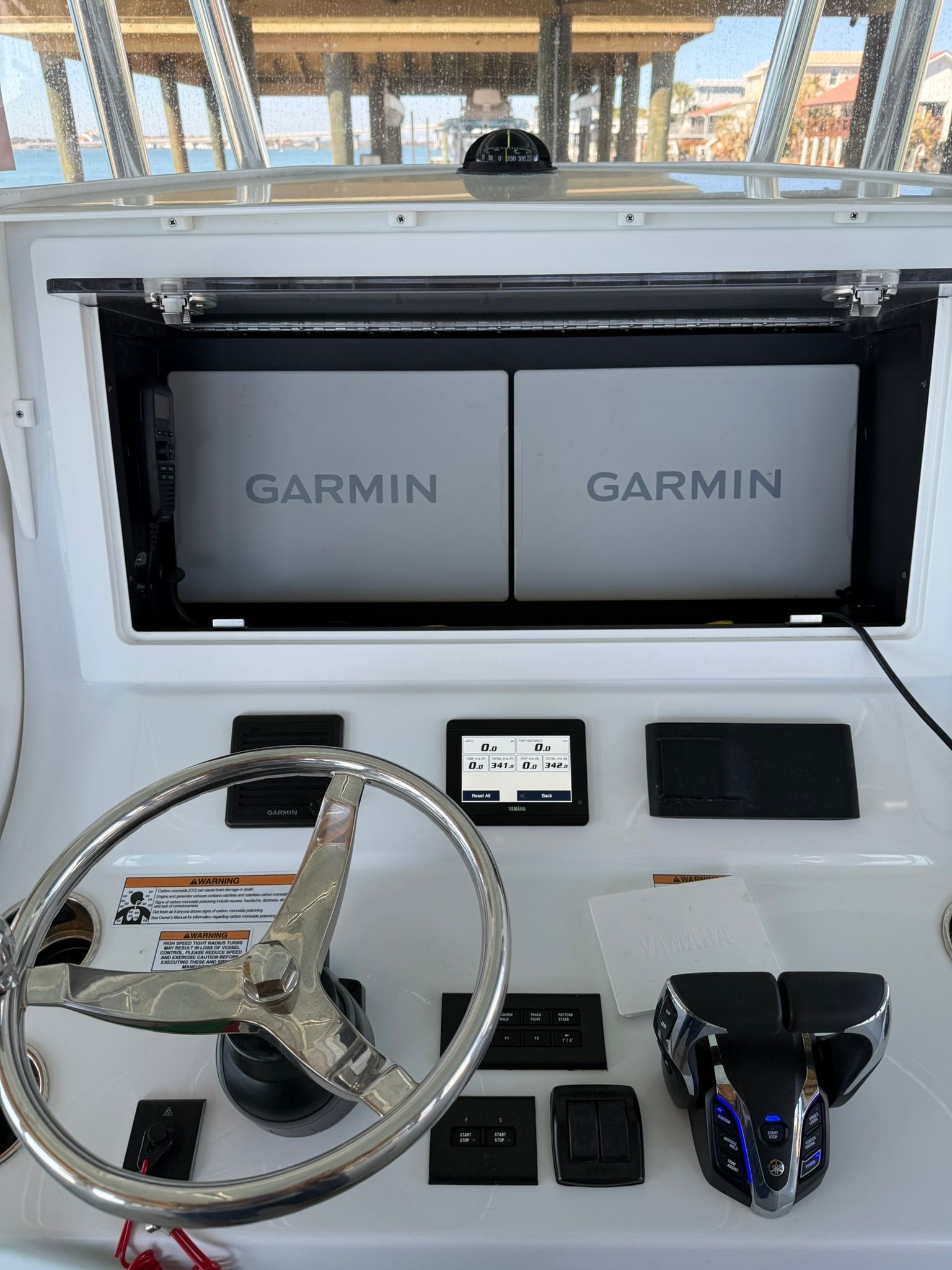 Contender 32 ST 2025 helm with Garmin displays.