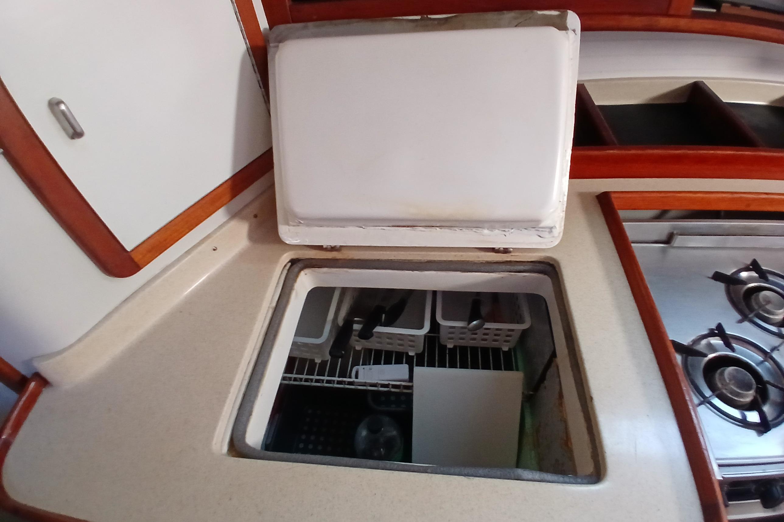 Interior of a 1995 Catalina 42 MkII yacht, featuring an open storage compartment.