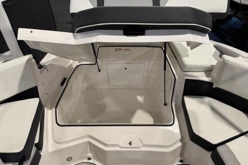 2026 Regal 21 OBX boat storage compartment with open hatch, showcasing spacious interior.