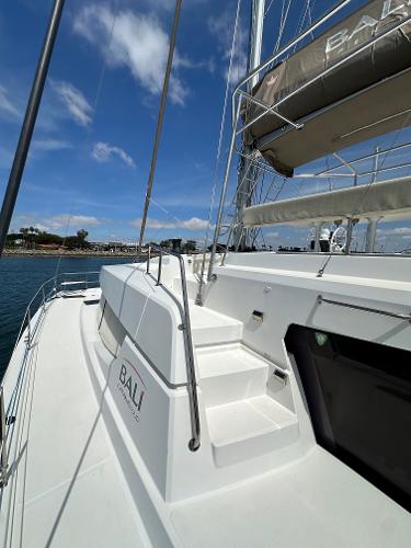 2021 Bali 4.8 yacht deck with clear blue sky and marina view.