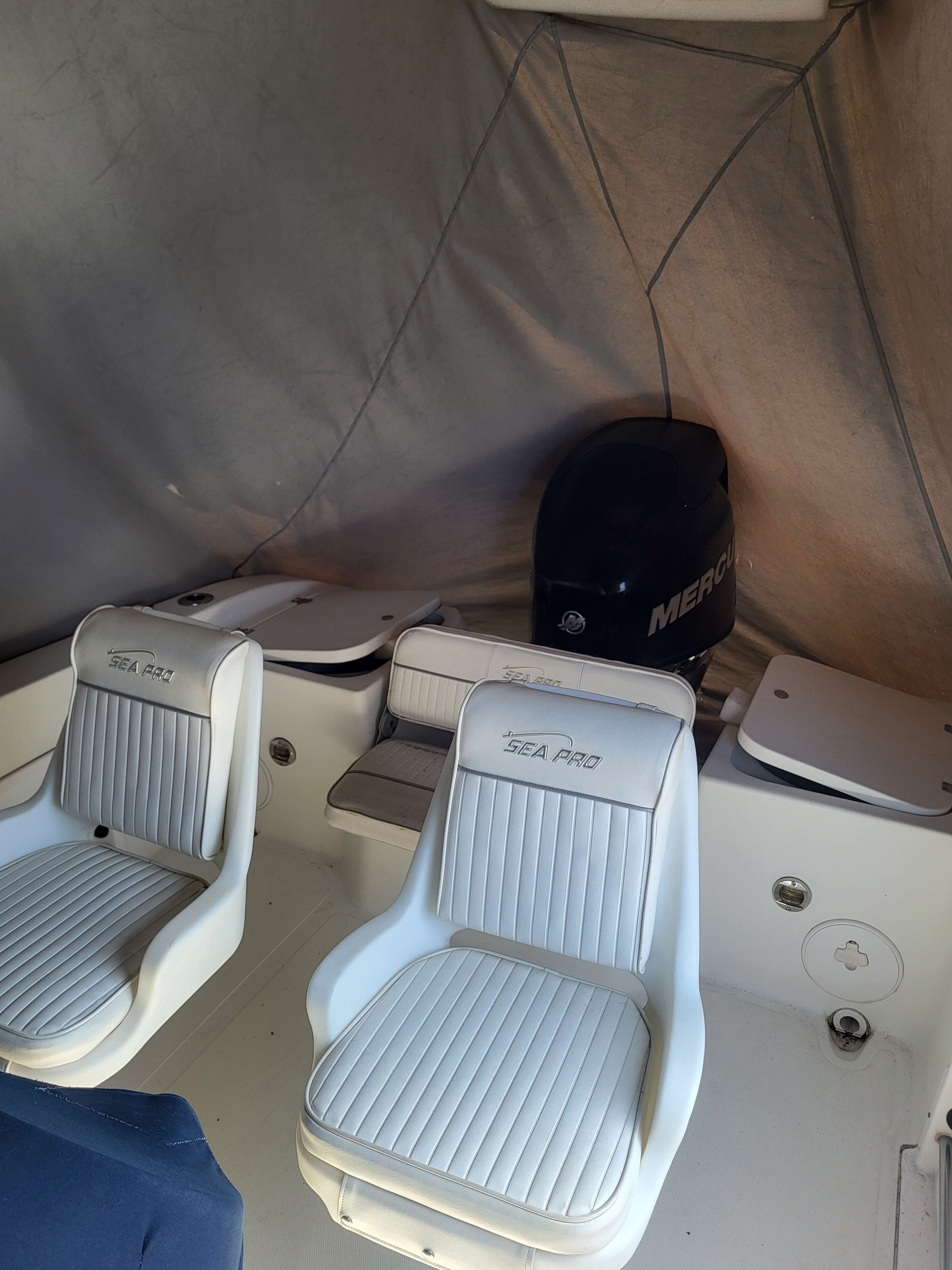 Interior of a 2008 Seapro Center Console boat with white seats.