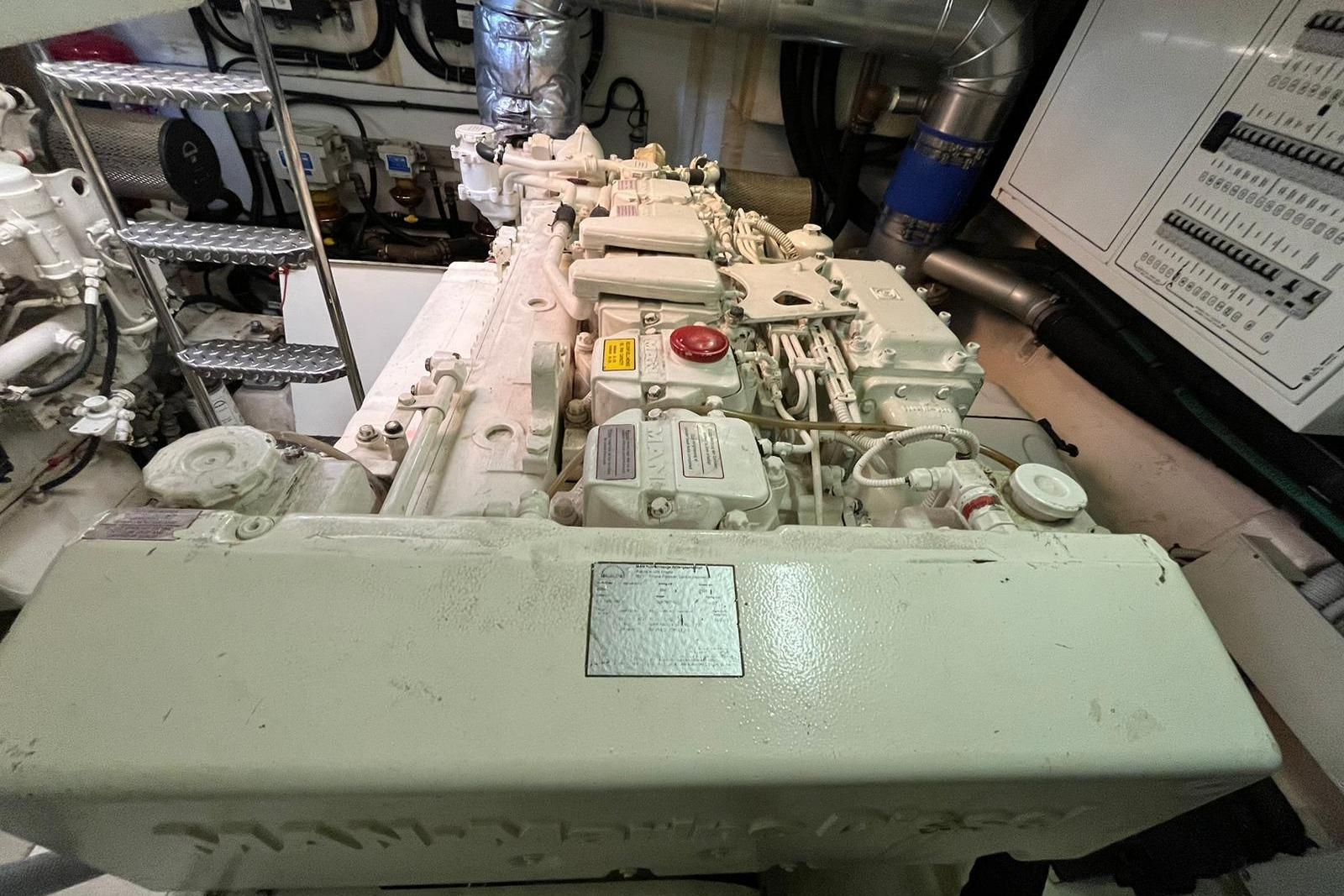 Engine room of 2009 Queens Yachts QUEENS 54, showcasing detailed machinery and components.