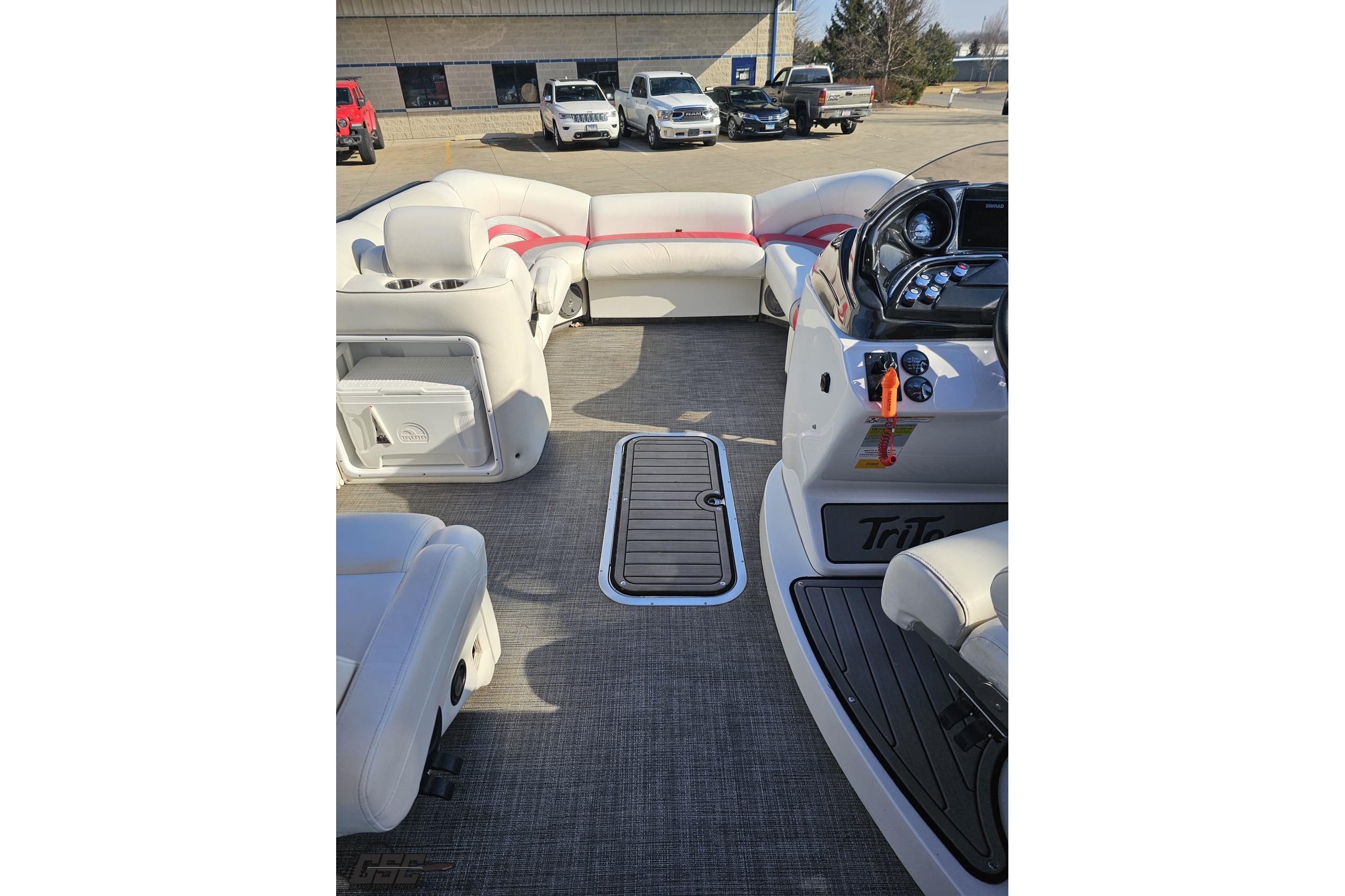 Interior of 2019 JC Tritoon Neptoon 25 Sport SL with plush seating and modern dashboard.