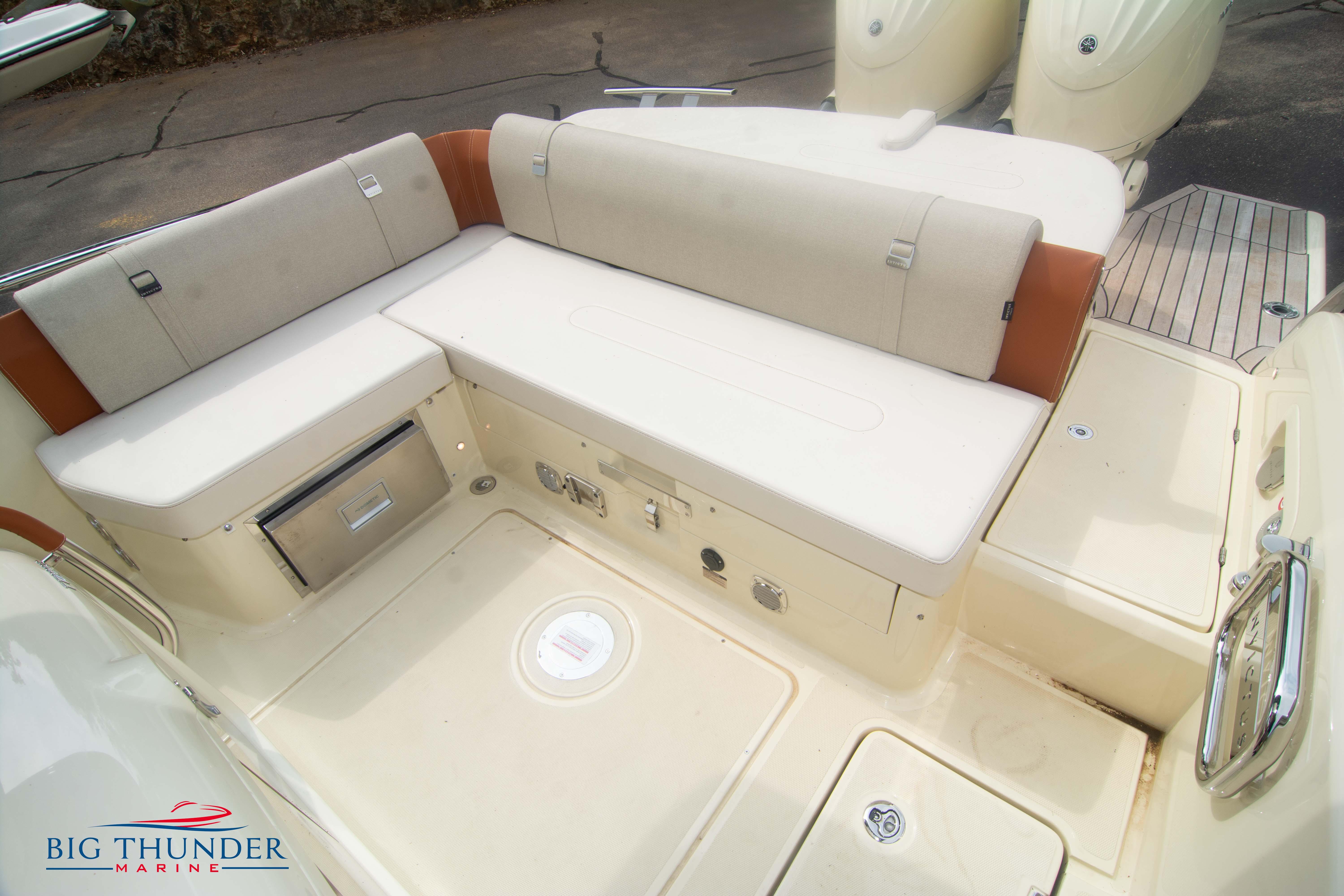 2024 Invictus TT280S boat seating area with storage compartments, showcased by Big Thunder Marine.