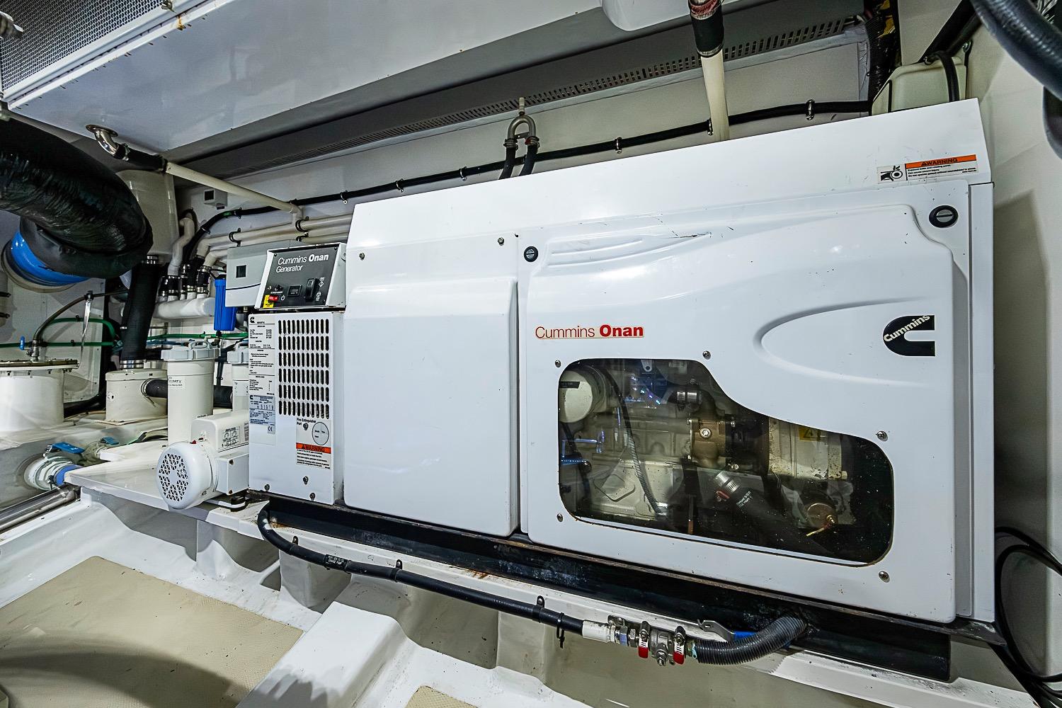 Engine room of 2014 Marlow 80 Explorer with Cummins Onan generator.