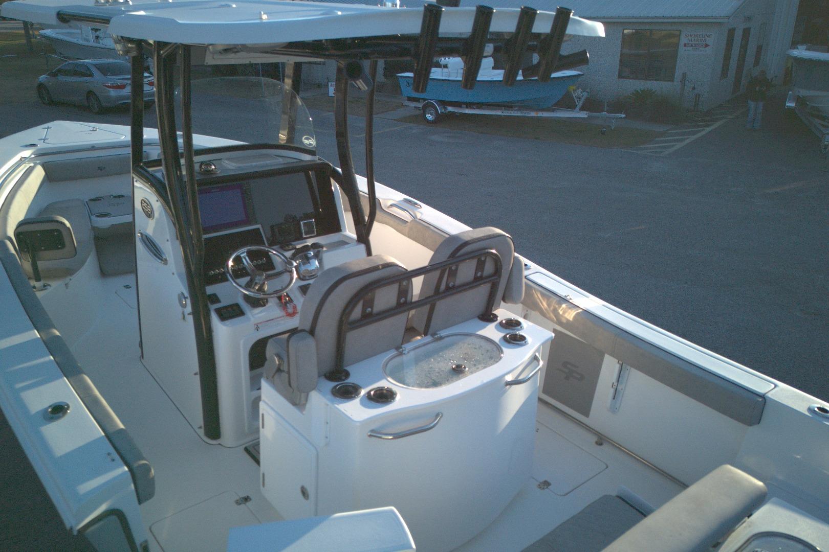 2021 Sea Pro 259 Center Console boat interior with helm and seating area.