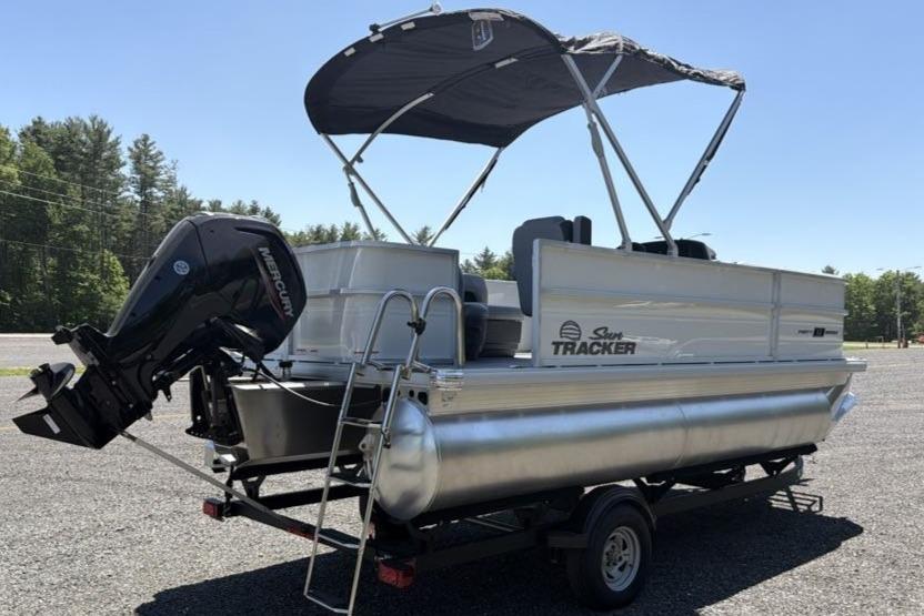 2026 Sun Tracker Party Barge 18 DLX pontoon boat with canopy and Mercury outboard motor.
