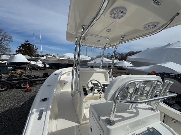 2025 NorthCoast 230 Center Console boat with sleek design, parked in a marina.